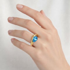 1.5 ct pear topaz silver, gold ring