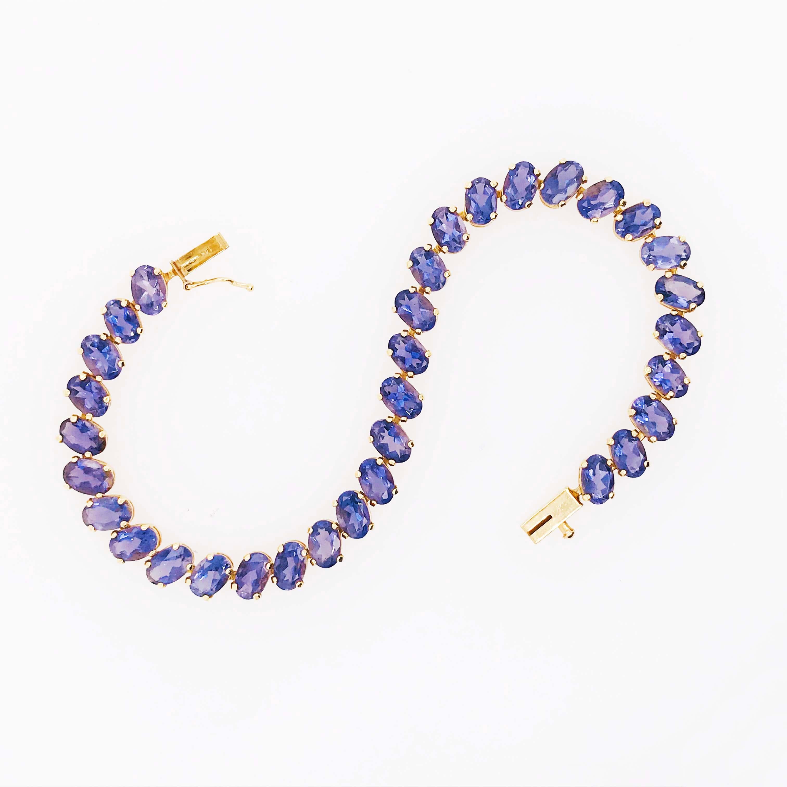 This 14kt Gold Tanzanite Bracelet is a fine jewelry fashion piece! With genuine tanzanite gemstones going around the entire tennis bracelet. There is a total Tanzanite weight of 15 carats! The 15 carat  Tanzanite gemstones are an oval, faceted shape