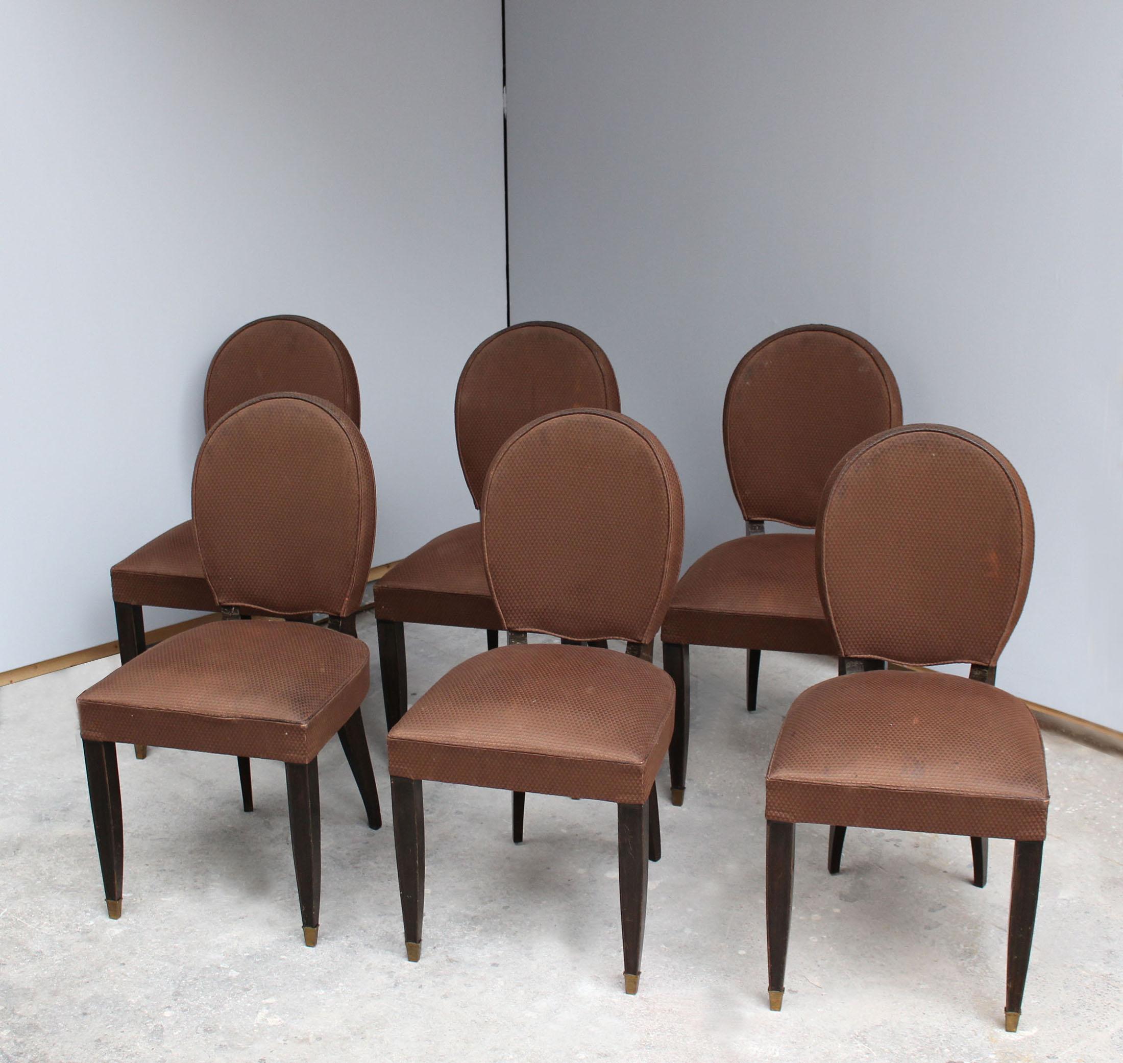 15 fine French Art Deco beech wood dining chairs (from 3 different sets) with oval backs. There are 2 sets of 6 ebonized wood (1 set with sabots and 1 set without sabots, and 3 light wood chairs with sabots).

Very small difference between sets (+