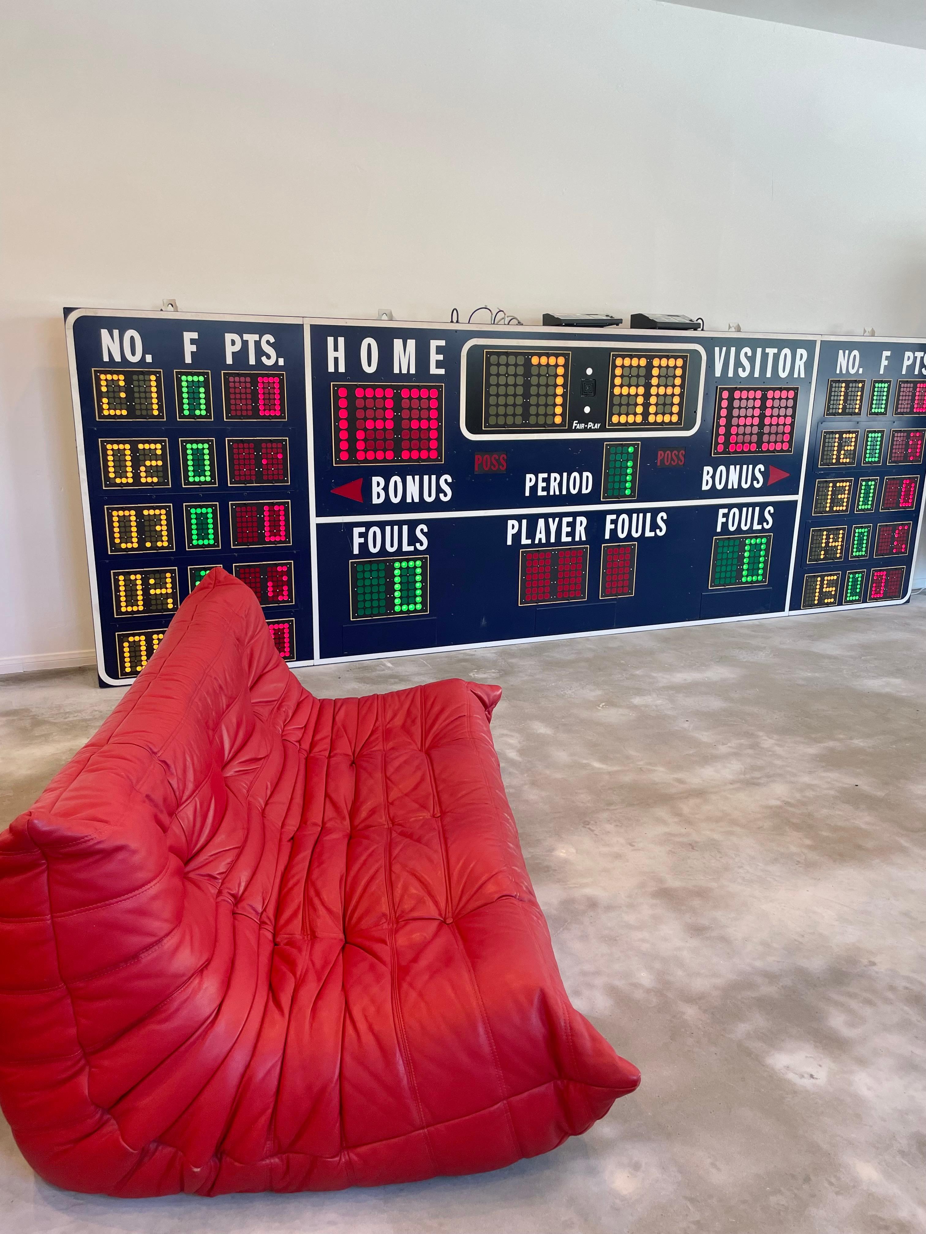Monumental vintage basketball scoreboard by Fair Play, made in the 1980s. Extremely unusual size with the player stats on both sides. Great blue color and metal case in very good condition. Comes with two controllers to operate the entire board.