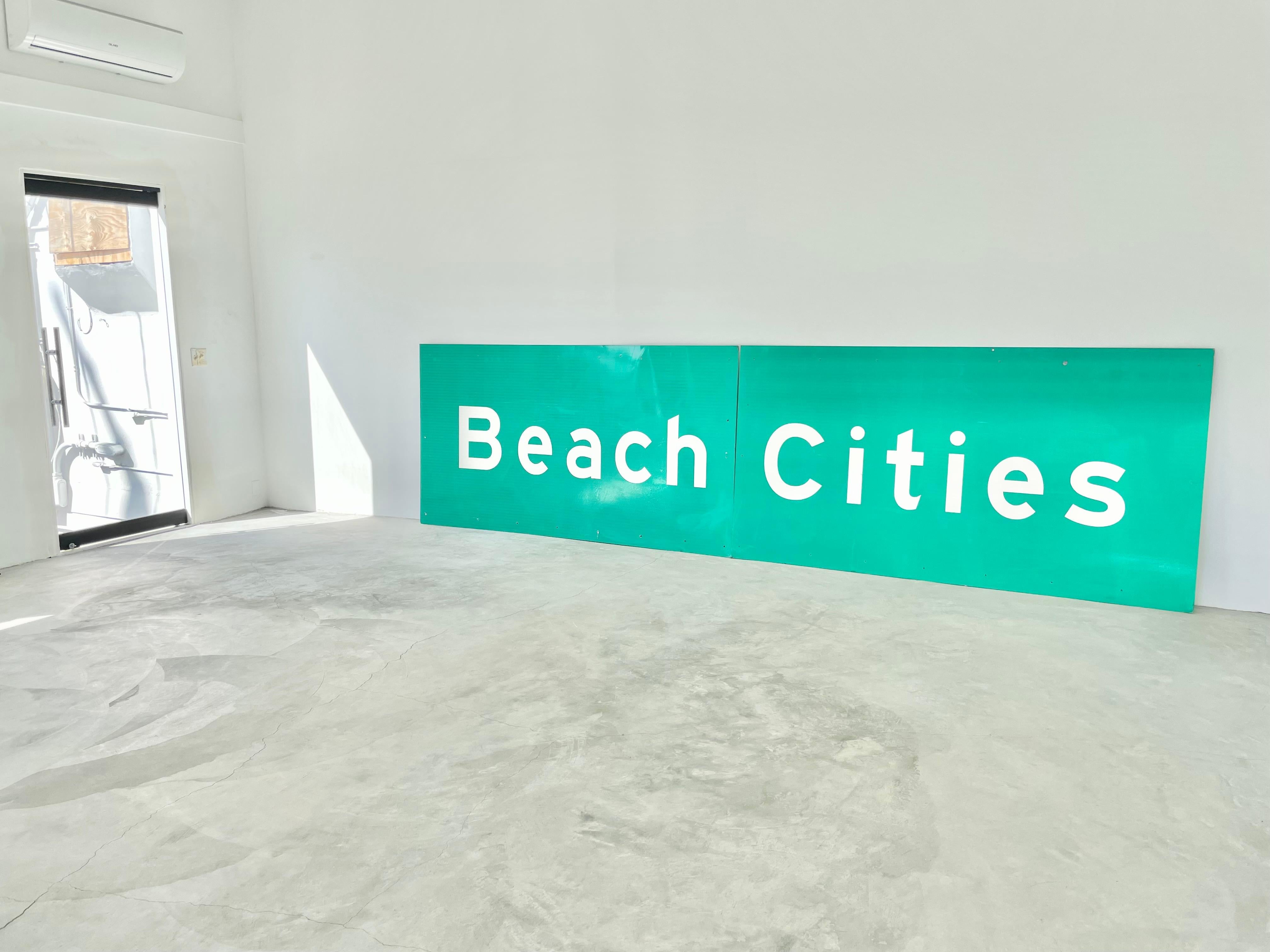 Monumental Los Angeles freeway sign from the 90s. Beach Cities sign showing people which way to Manhattan Beach, Redondo Beach and other cities. Reflective material. In great condition for its age. Would look amazing framed and hung in a beach