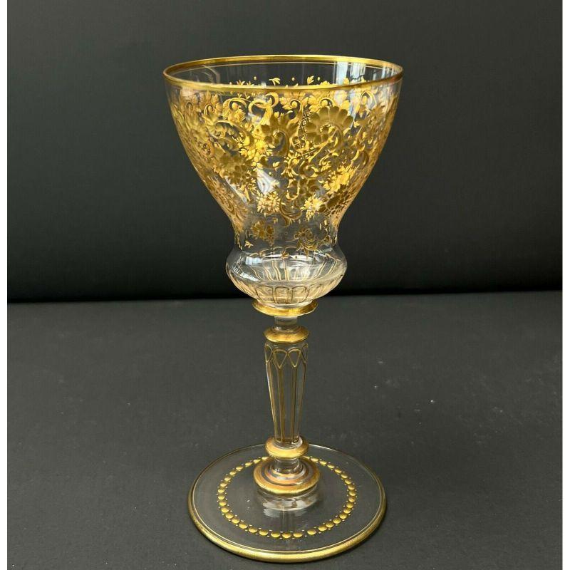 15 Gilt Intaglio cut glass sherry wine glasses florals, 2nd quarter 20th century

Intaglio cut gilt florals, leaves, and scrolls to the bowl, dot decoration to the base. Gilt to the rims and to the stem. 

Additional Information:
Material: