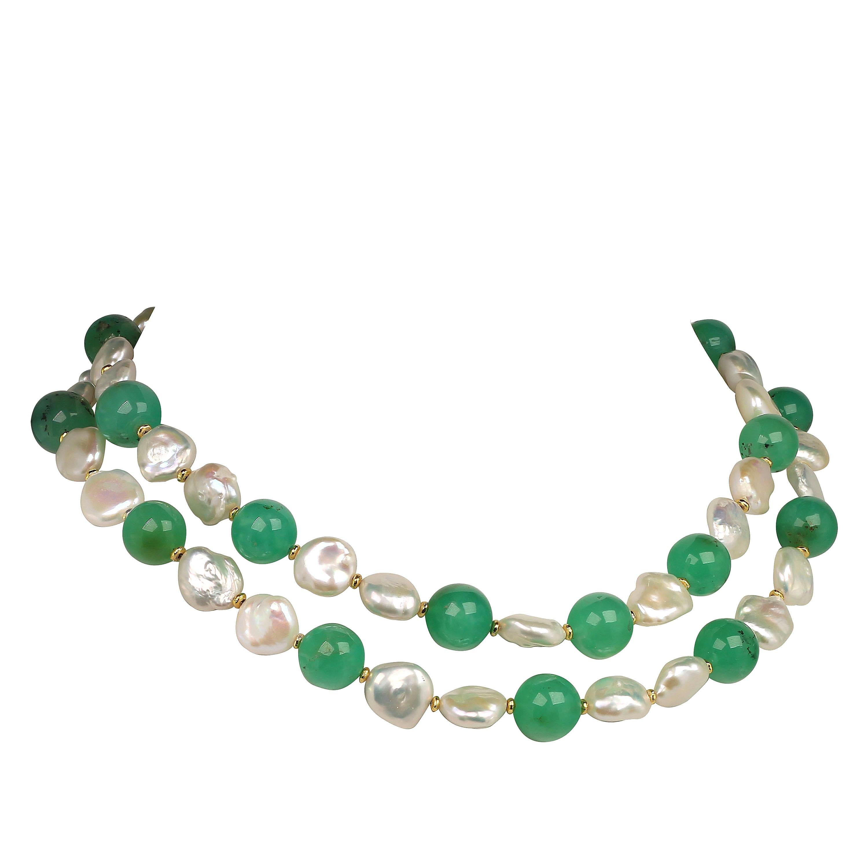 Own the jewelry you desire

Handmade, iridescent white Baroque Pearl and green Chrysoprase double strand choker necklace.  Wow!  This unique double strand choker style necklace is perfect in color and size.  At 15.5 and 16.5 inches the two strands