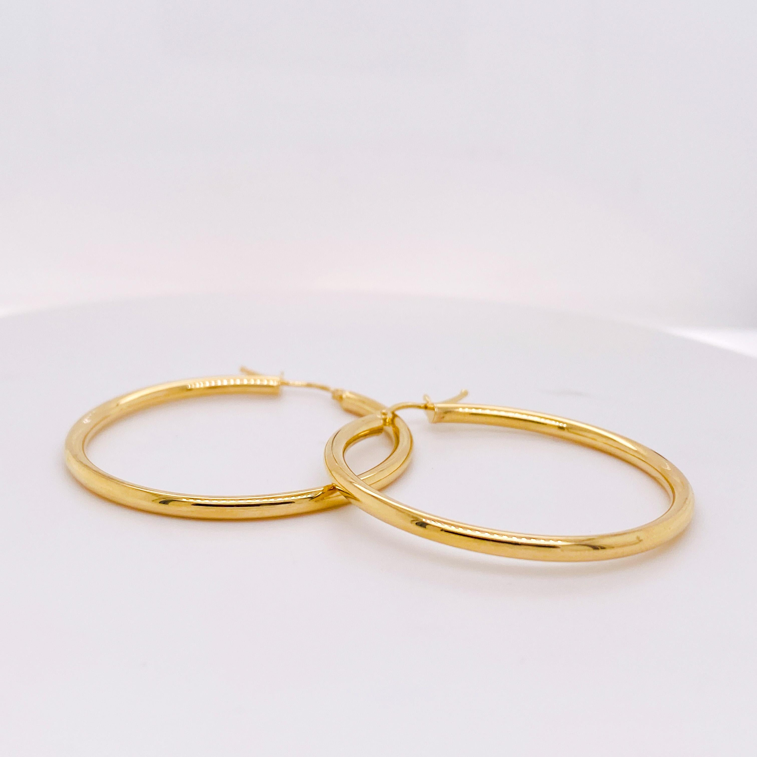 This 1.5 inch gold hoop is the latest fabulous hoop earring you need! These 2 mm wide hoop earrings are lightweight and easy to wear so it does not pull on your earlobes... And they're perfect for any hair length! Yellow gold color is what all the