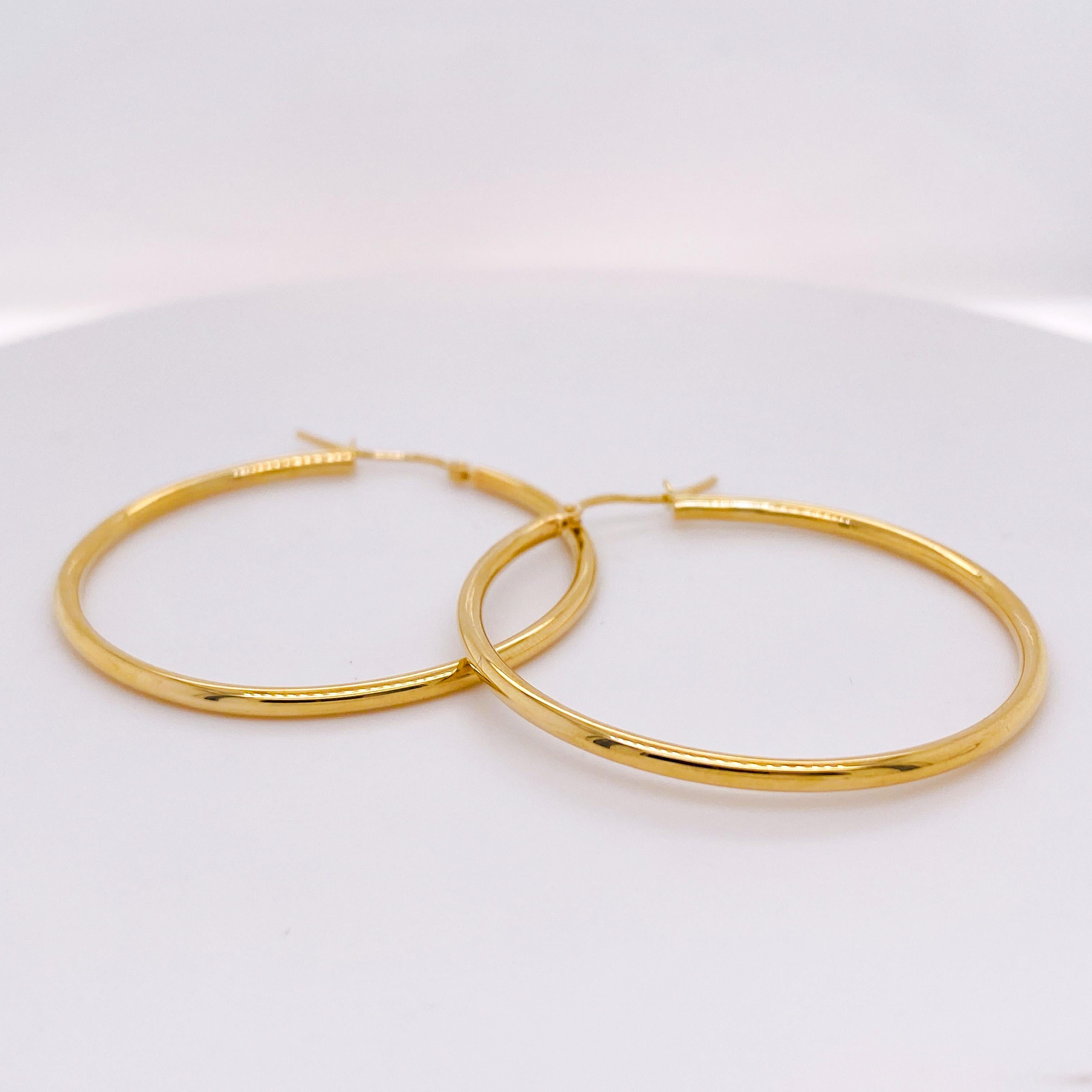 This 1.5 inch gold hoop is the latest fabulous hoop earring you need! These 2.5 mm wide hoop earrings are lightweight and easy to wear so it does not pull on your earlobes... And they're perfect for any hair length! Yellow gold color is what all the