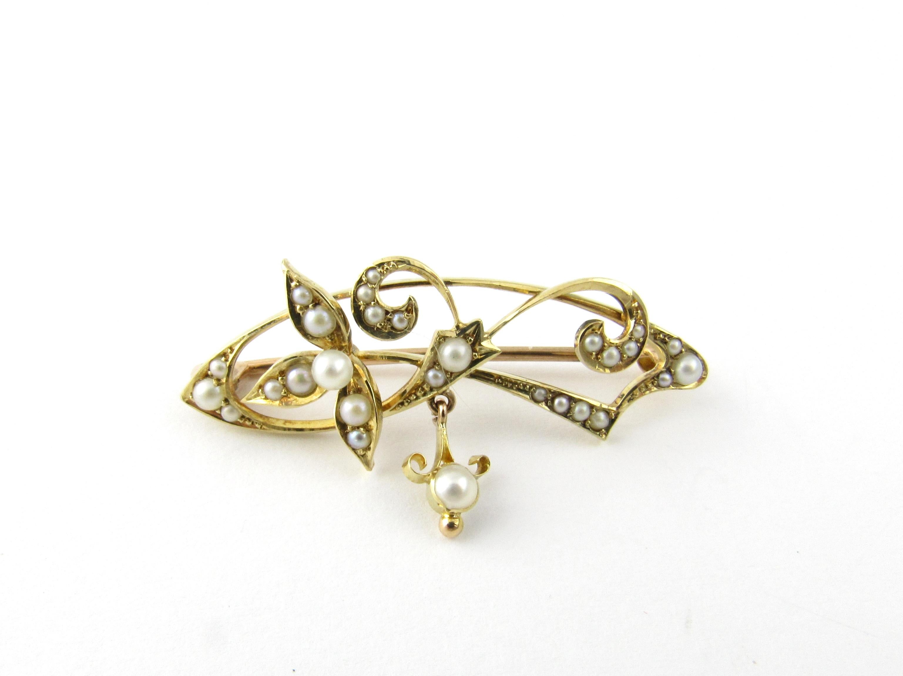 Vintage 15 Karat Yellow Gold and Seed Pearl Brooch/Pin

This lovely brooch features 28 seed pearls set in beautifully detailed 15K yellow gold.

Size: 37 mm x 12 mm

Weight: 2.1 dwt. / 3.3 gr.

Stamped: 15 ct

Very good condition, professionally