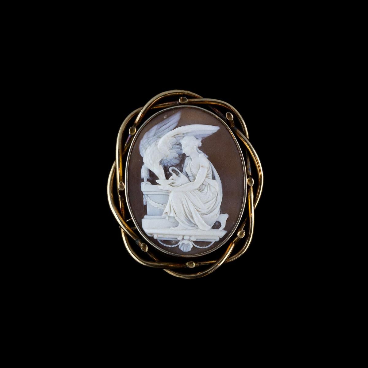 Antique Victorian brooch with cameo depicting goddess Ebe with Zeus transformed into an eagle in a beautiful 15 kt yellow gold carved frame.
The goddess Ebe in Greek mythology is the bright and laughing deity of youth, daughter of Zeus and Hera.
Her
