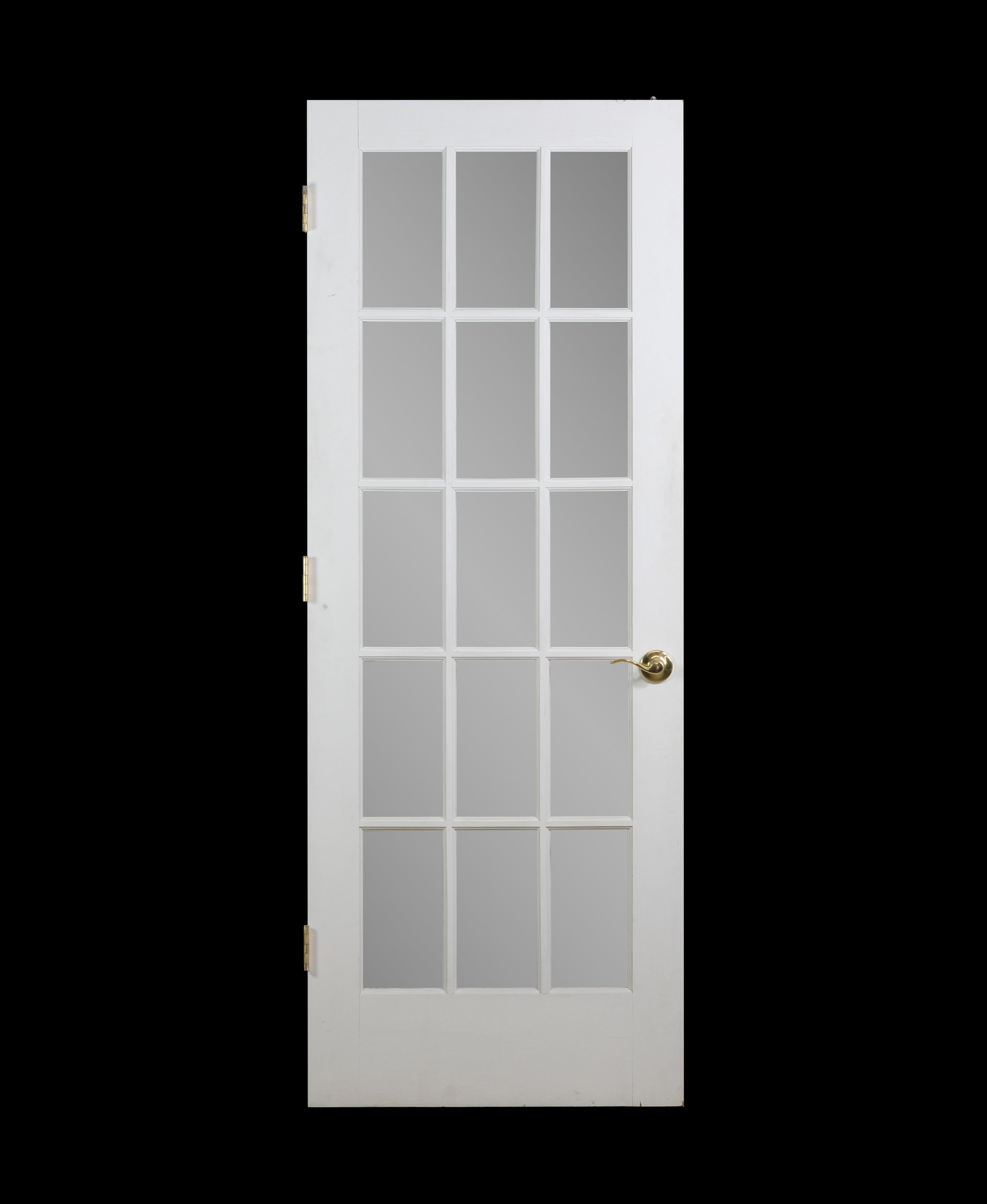 White painted wood French door with 15 lites and the original brass lever hardware. Please note, this item is located in our Scranton, PA location.