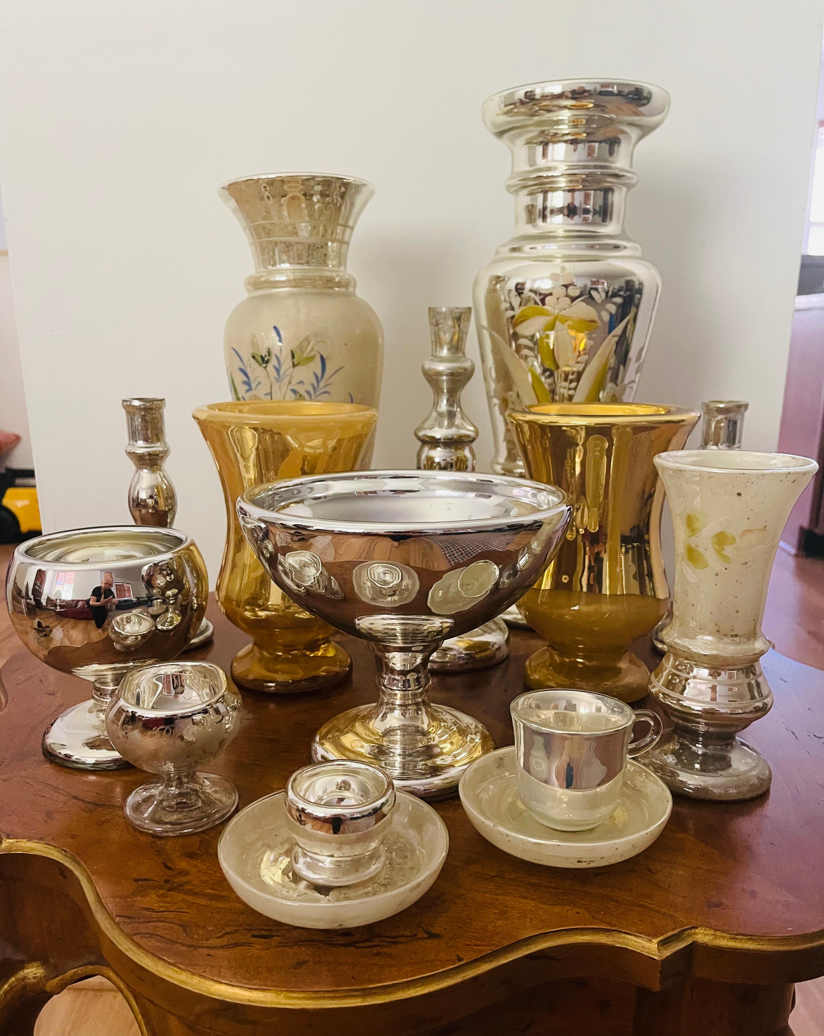 Antque and vintage collection of 15 pcs Mercury glass silver and gold vases and bowls. Largest vases are Handpainted and measured 16” and 14”, large bowl is 8” high, the smallest piece- 2”. Some have mercury loss due to age. Mouthblown glass,