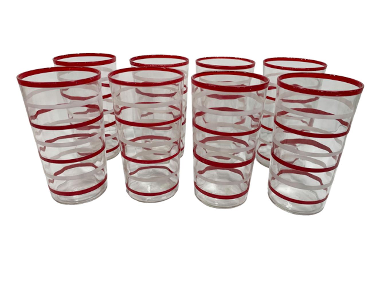 Fifteen piece hand painted Art Deco cocktail shaker and glasses. A large ring-molded tapered shaker with aluminum top along with eight highball glass and six cocktail glasses all with hand painted red and white rings.