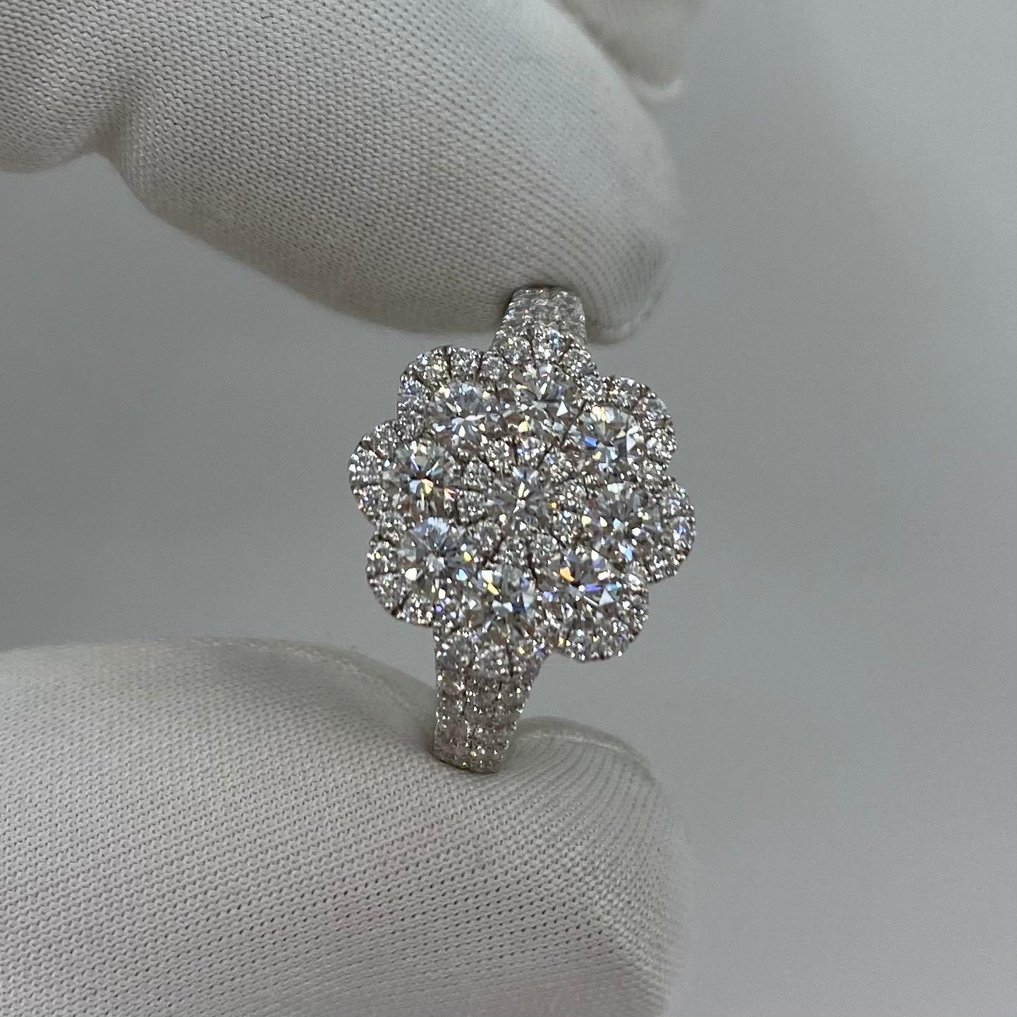Art Nouveau Style Diamond Cluster Flower Ring.

A beautiful and unique 18 Karat white gold flower style ring, absolutely filled with pave-set diamonds.
1.50 Carat of diamonds with VS 1-2 clarity and E/F colour. All have an excellent cut and polish