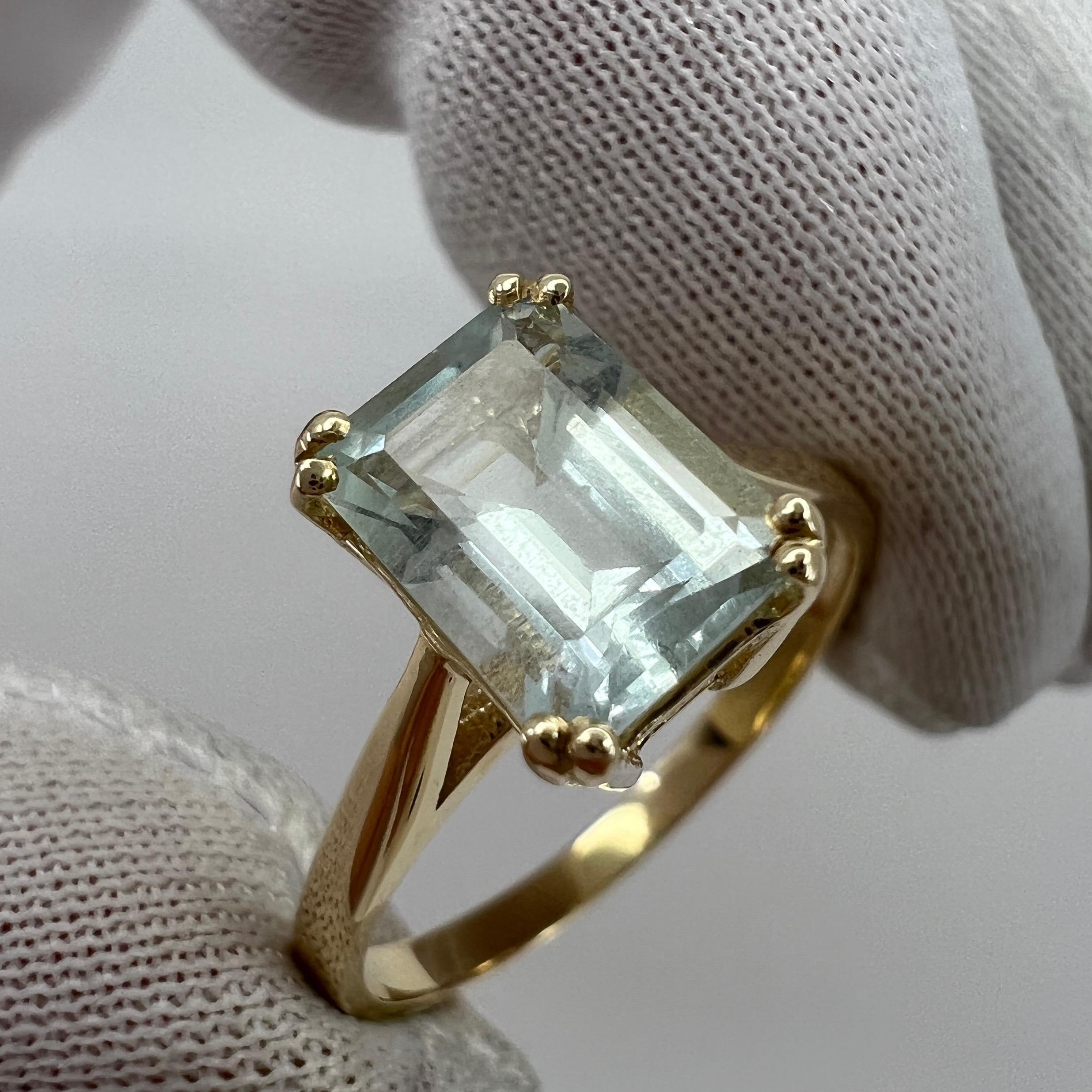 Light Blue Emerald Cut Aquamarine Solitaire Yellow Gold Ring.

1.50 Carat aquamarine with a stunning bright blue colour and good clarity, some small natural inclusions visible (as shown in photos) but not a dirty stone. 

Also has an excellent