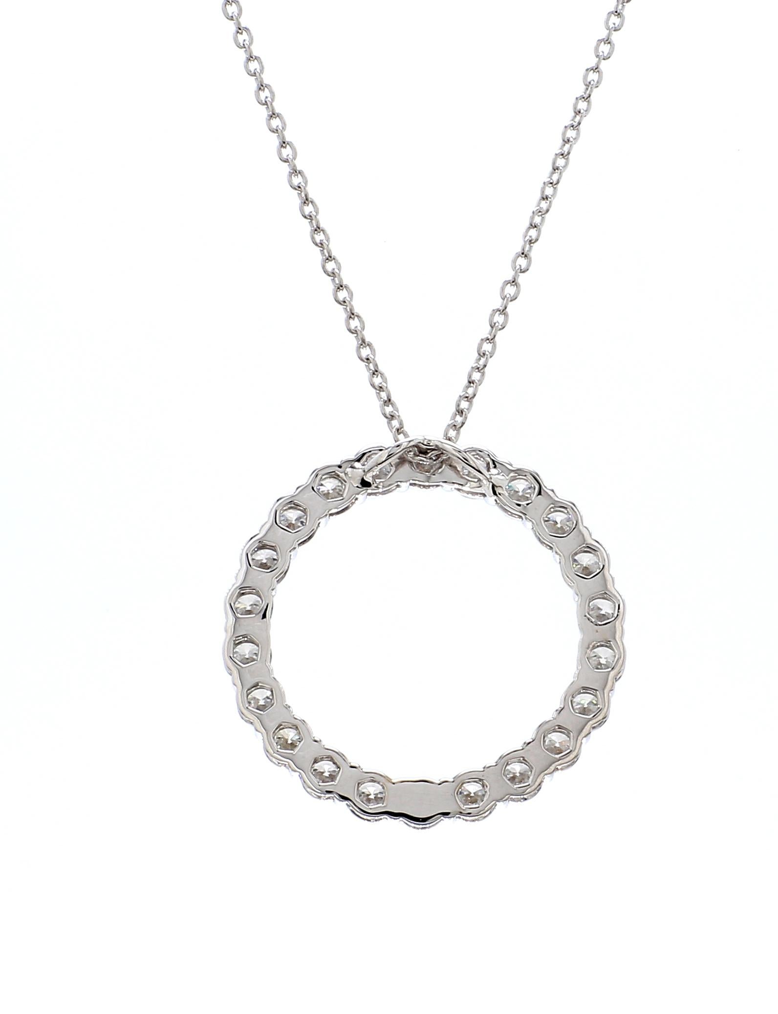An elegant expression of timeless sophistication, this exquisite pendant necklace features a brilliant Circle of Life Shape framed by a delicate halo of round brilliant diamonds, all masterfully set in polished 18K white gold. The graceful teardrop