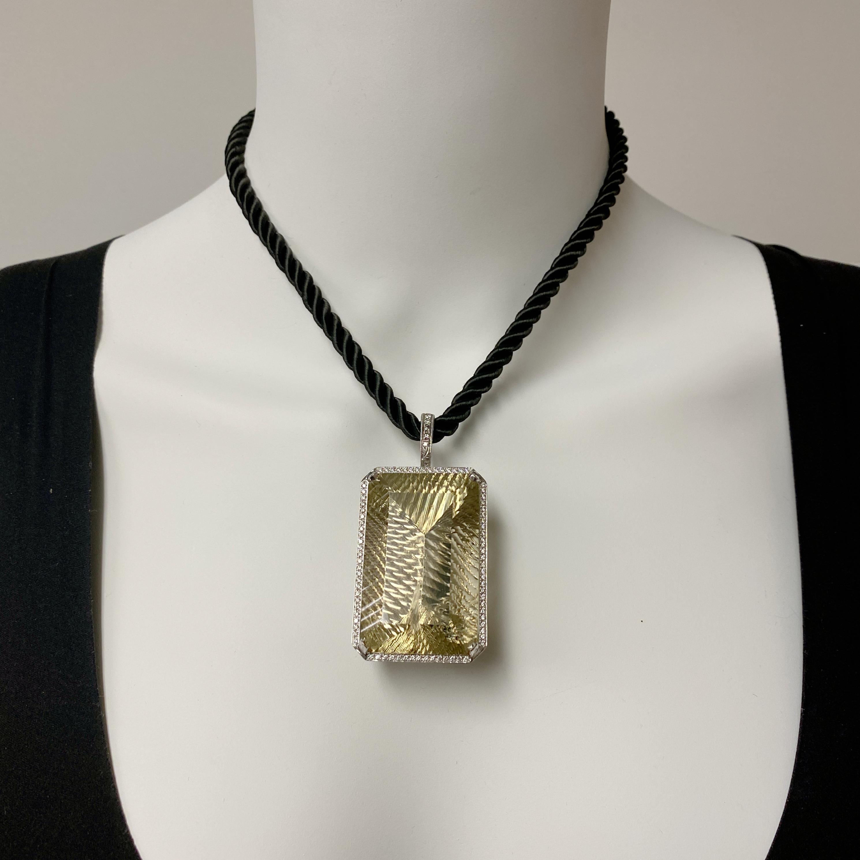 Story time!  About ten years ago, one of Eytan Brandes' customers bought this enormous quartz at a gem show and asked Eytan to make her a diamond pendant to show it off.  Eytan made the pendant, set the diamonds, added a fixed chain, then, well, he