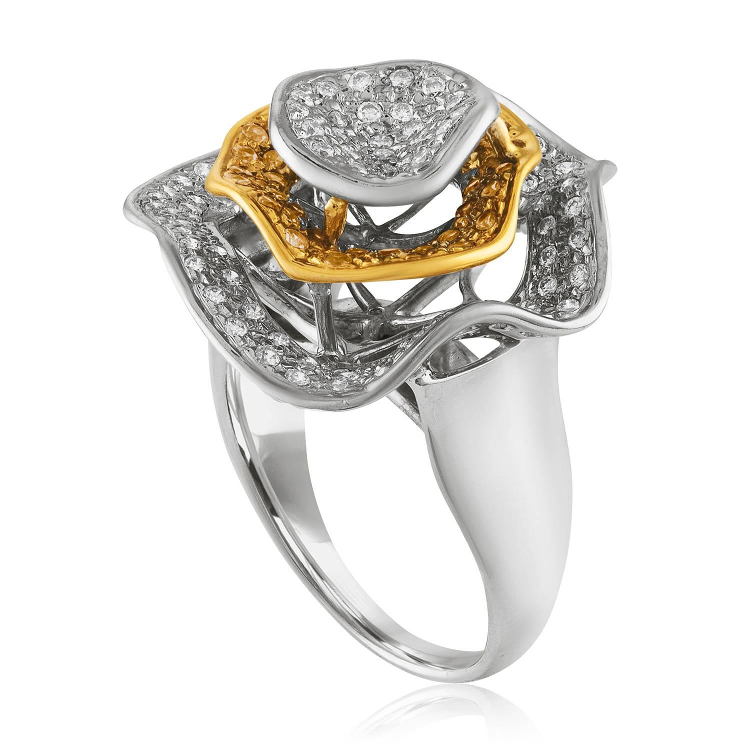 Abstract Flower Ring
The ring is 14K White and Yellow Gold
There are 1.00 Carats in Diamonds G VS
There are 0.50 Carats in Yellow Sapphires
The top of the ring measures 1