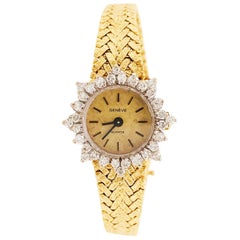 Montre pour femme en or jaune 14 carats avec lunette en quartz de Genève et diamants de 1,50 carat