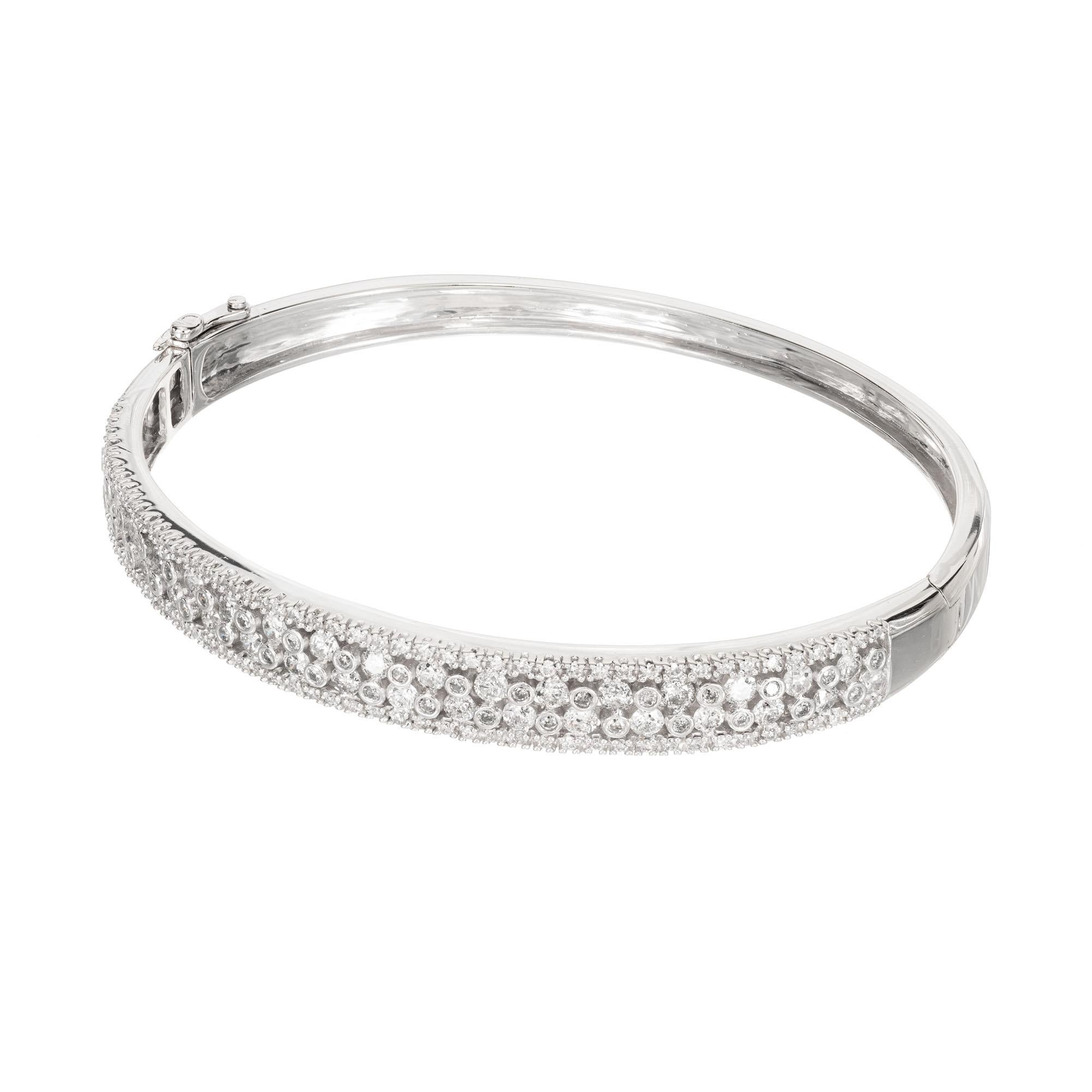 Open work diamond bracelet in 14k white gold with 4 rows of round Diamonds. Built in catch and side lock safety.

168 round Diamonds, approx. total weight 1.50cts, H, SI – I 
Fits a standard 7 to 7 1/2-inch wrist 
14k white gold 
19.2 grams 
Tested