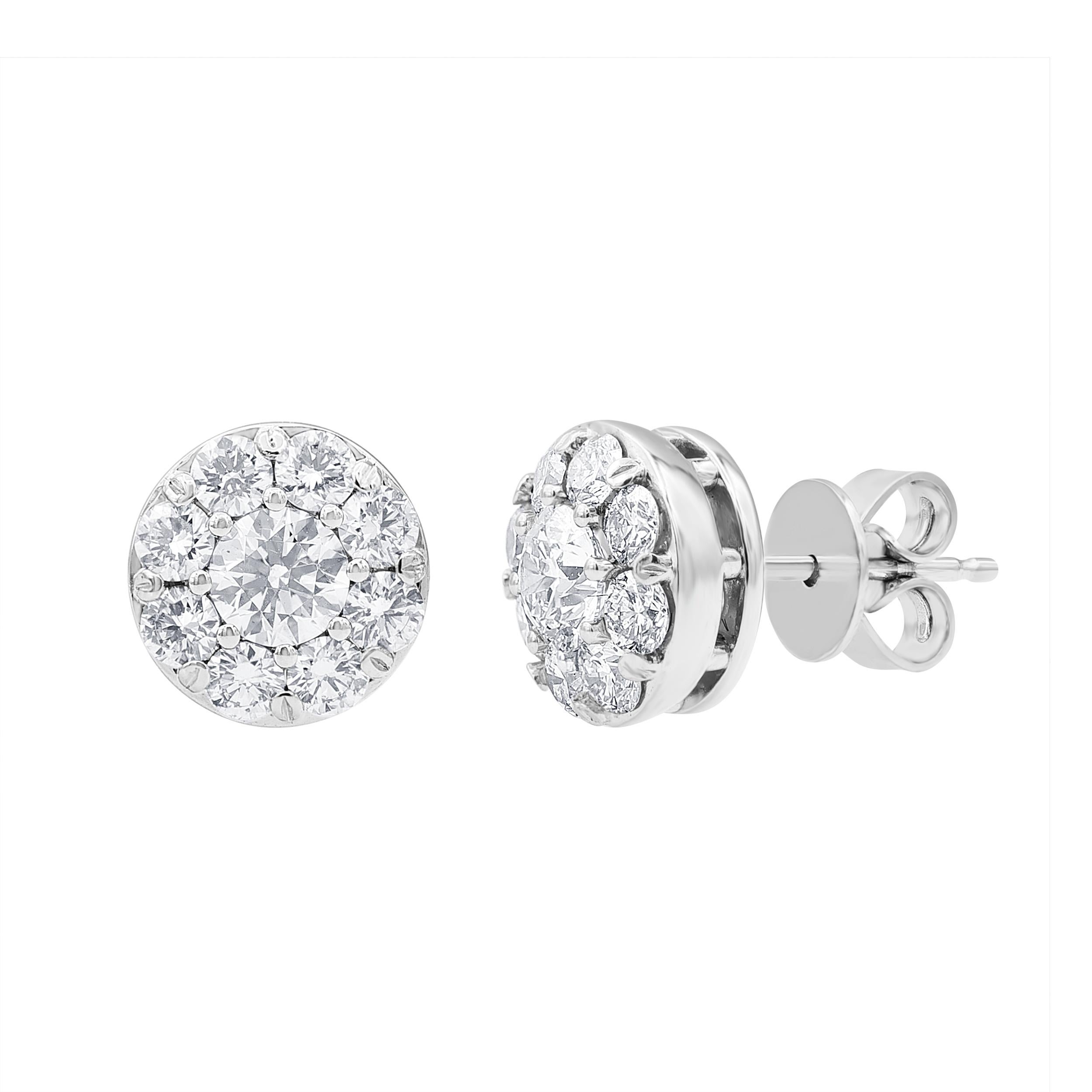 A bright addition to any attire, these diamond stud earrings create a sensation. Crafted in 14K white gold, each earring showcases a sparkling 3/4 ct.  boasting a color rank of H and clarity of VS - wrapped in a frame of petite diamonds. Captivating