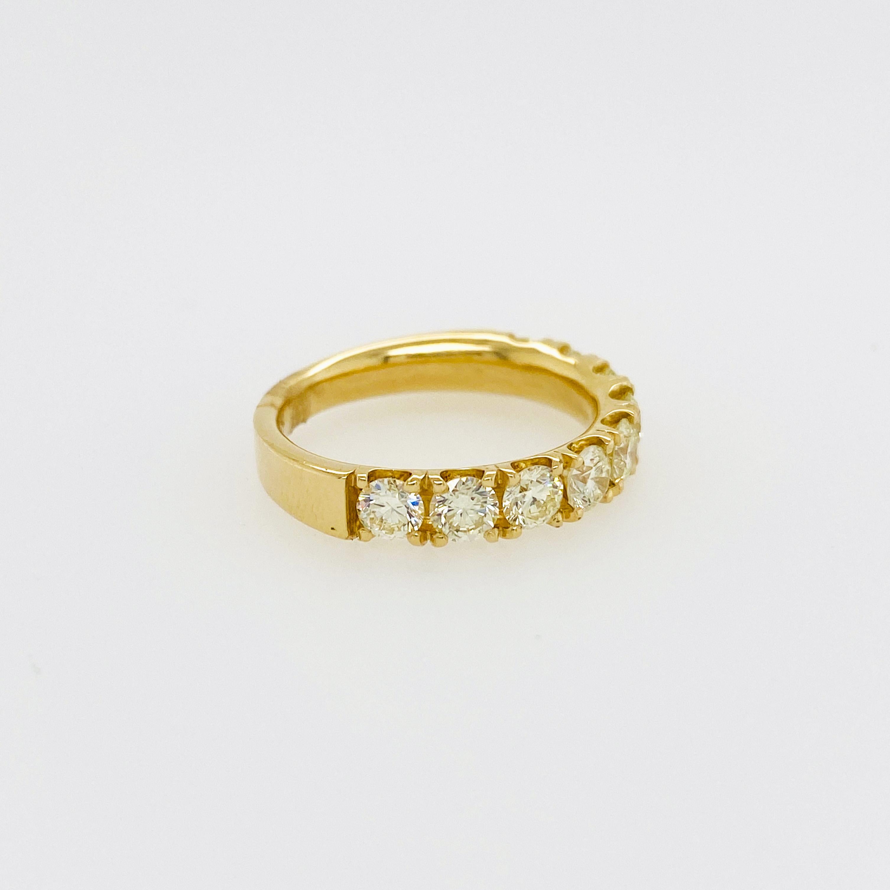 The diamond band has nine round brilliant diamonds set in four yellow gold prongs. The half diamond band is the perfect size to wear solo or pair it with other stackable rings. Thee design is classic and sleek with a low profile setting and secure