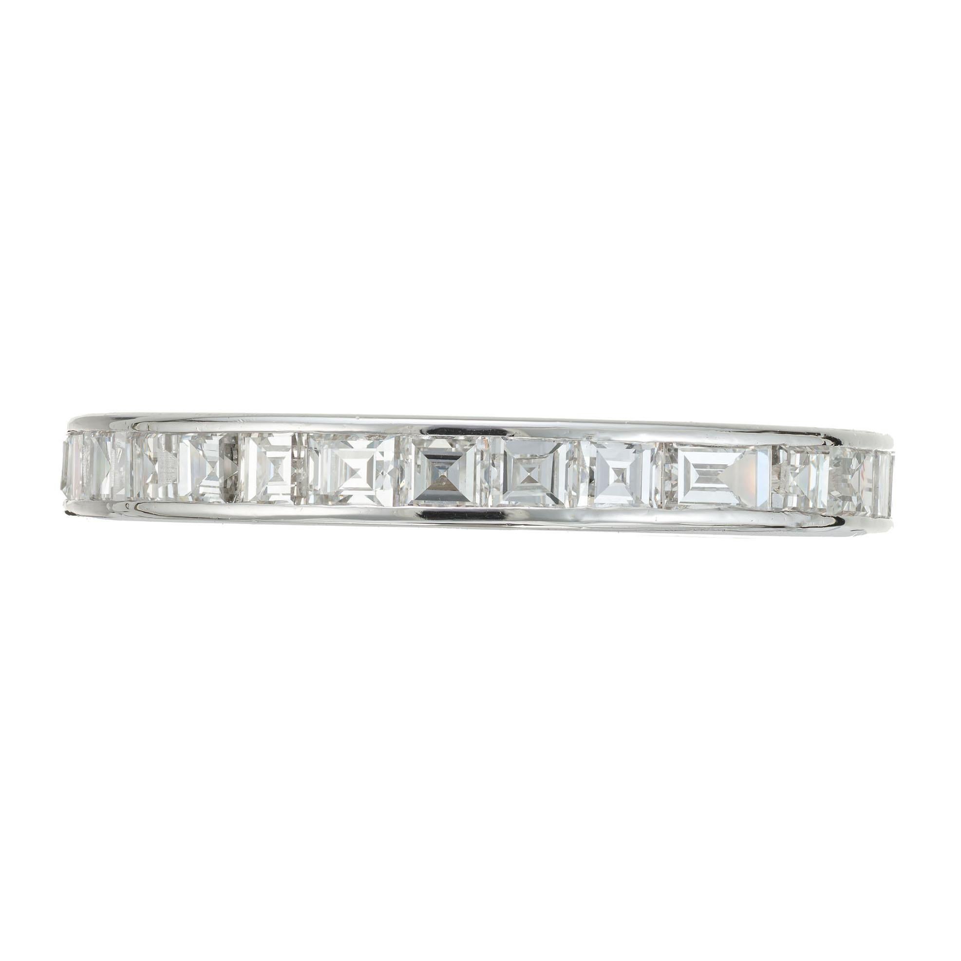 Handmade vintage eternity wedding band ring. 30 square step cut diamonds in a platinum setting.  

30 step cut diamonds, G VS approx. 1.50cts
8.25 and sizable
Platinum 
3.9 grams
Width at top: 3.0mm
Height at top: 2.0mm
Width at bottom: 3.0mm


