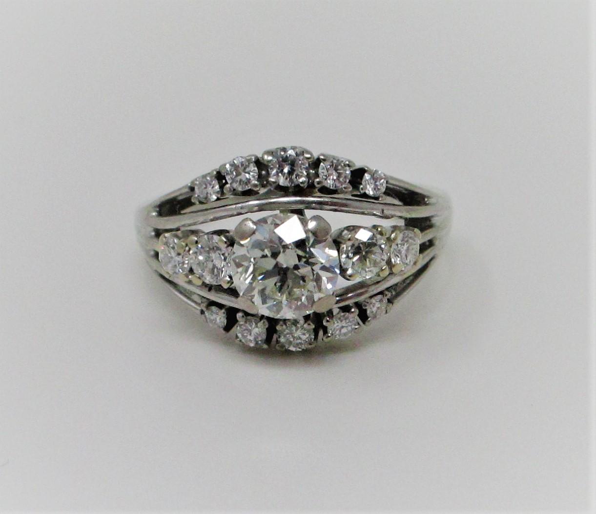 Retro 1.50 Carat total weight three row diamond ring set in 14 Karat white gold.  Size 6.