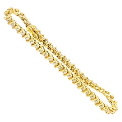 Bracciale tennis con diamanti da 1,50 carati, stile S, in oro giallo