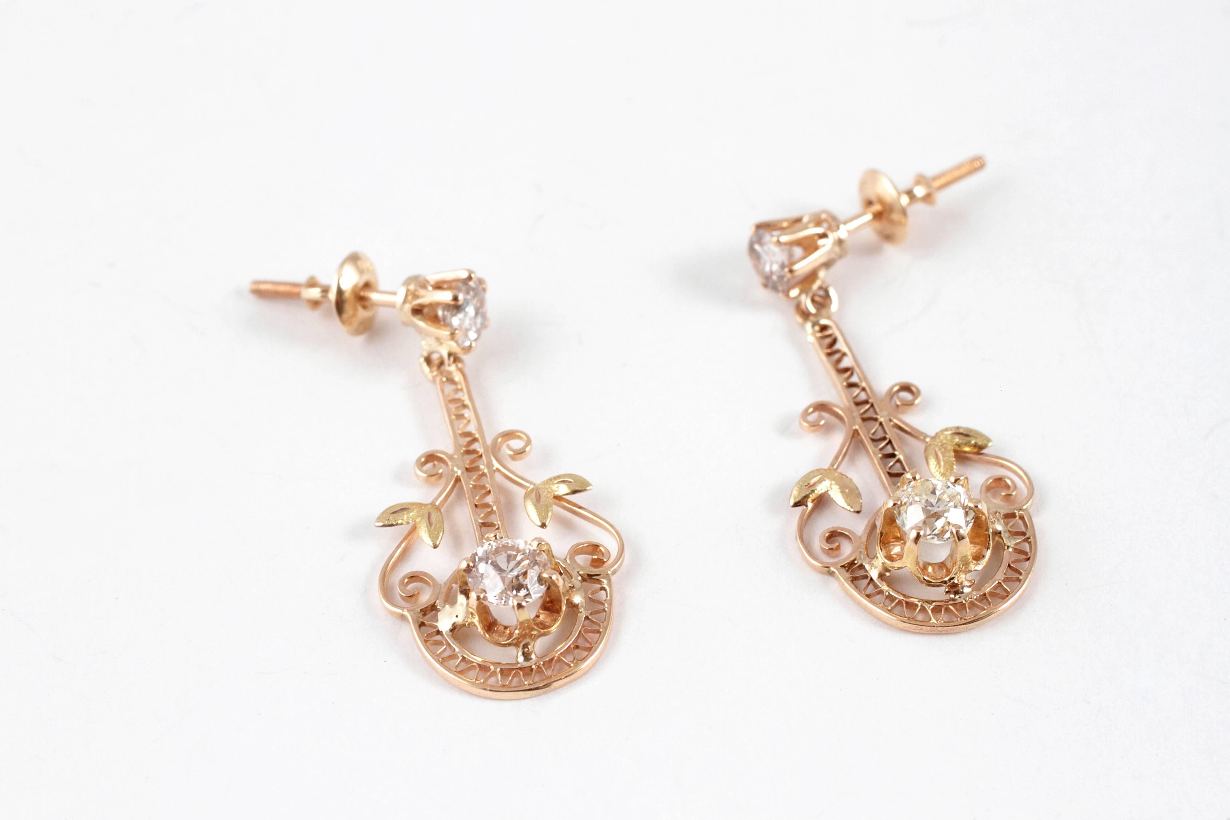 Composed of 10 and 14 karat yellow gold, with 1.50 carats of diamonds and secured with a thread back. These are lovely on!