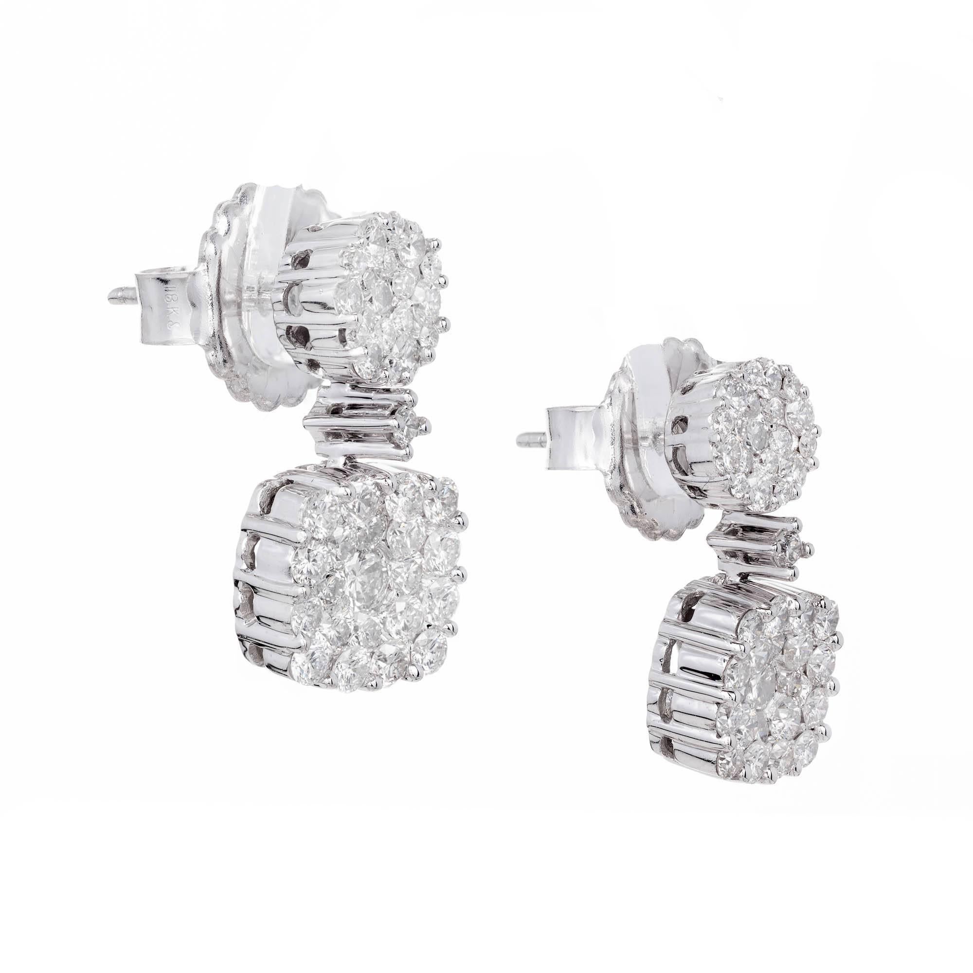 18k white gold Diamond cluster dangle earrings with bright white full cut Diamonds.

80 round full cut Diamonds, approx. total weight 1.50cts, H, SI1
18k white gold 
5.9 grams
Tested and stamped: 18k
Top to bottom: 18.74mm or .74 inch
Width: 9.37mm