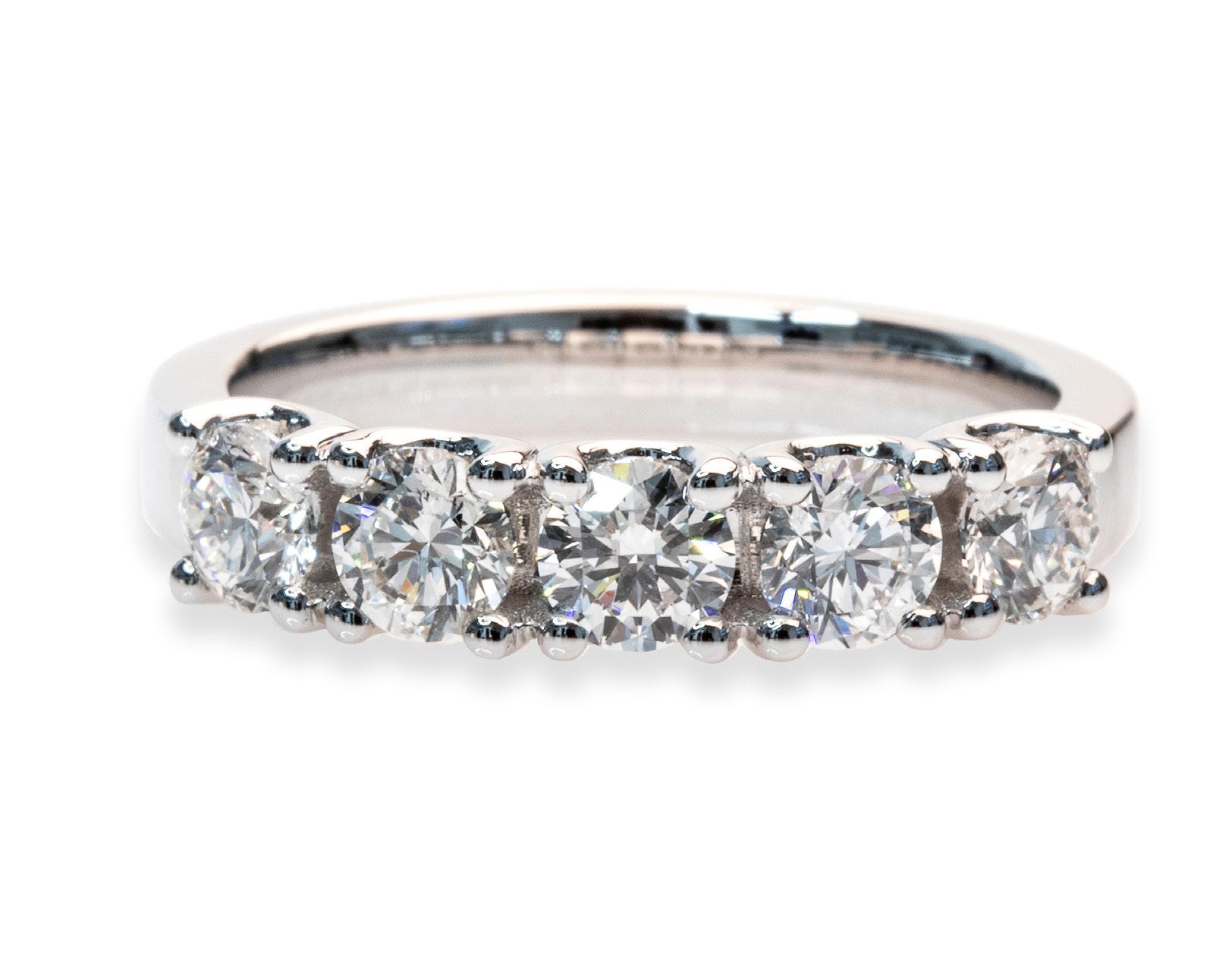 Exquisite 1.50 Carat total, E-F color, and SI clarity 18K White Gold 5 Diamonds Round Brilliant Cut Band Ring, a refined and versatile piece designed to captivate.

This stunning band ring features five brilliant round diamonds, each with an
