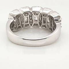 1.50 Carat Emerald Cut and Round Diamond Ring