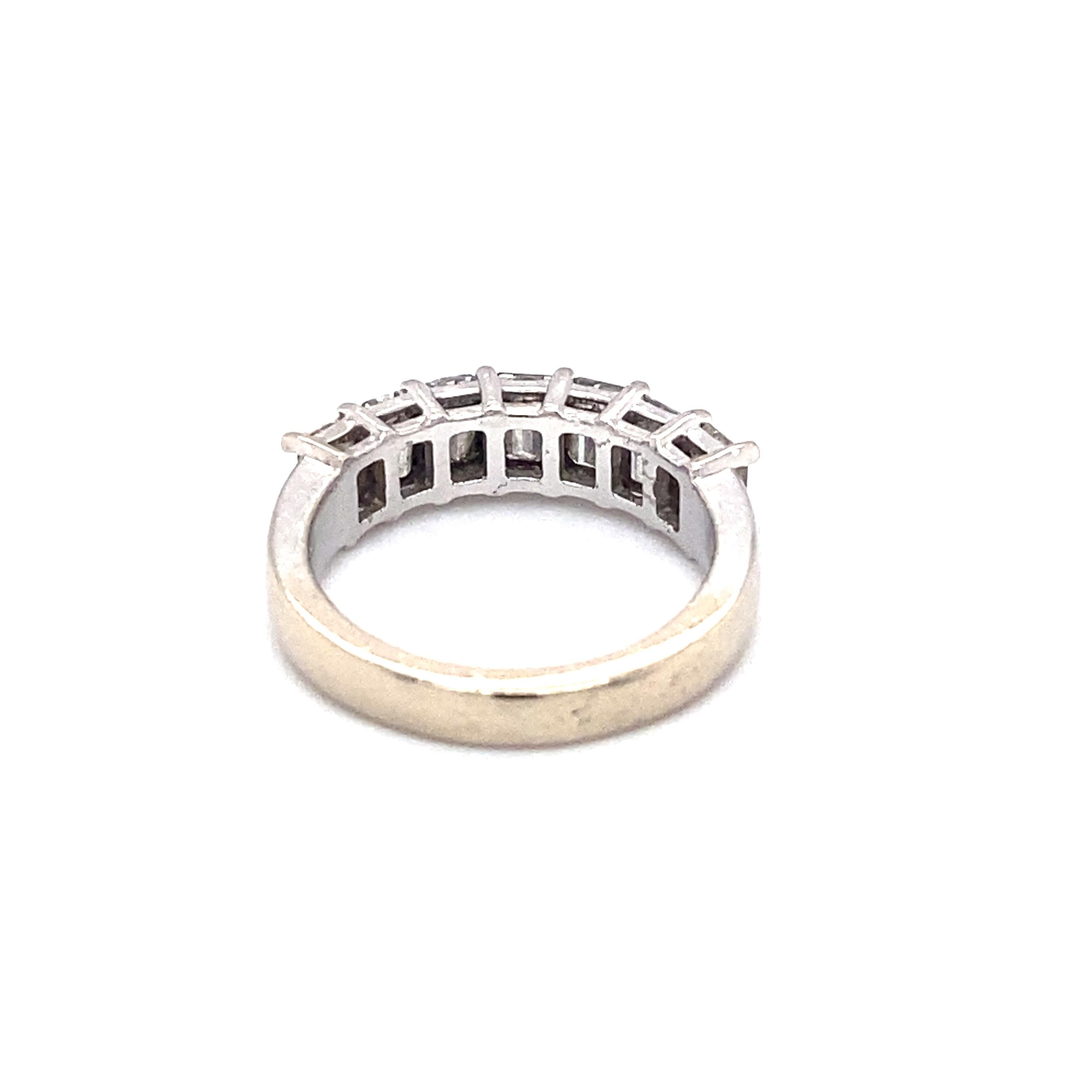 Item Details: This ring with emerald cut diamonds is perfect for an anniversary band.

Circa: 1980s
Metal Type: 14k white gold
Weight: 3.5g
Size: US 4, resizable

Diamond Details:

Carat: 1.50 carat total weight
Shape: Emerald cut
Color: G
Clarity: