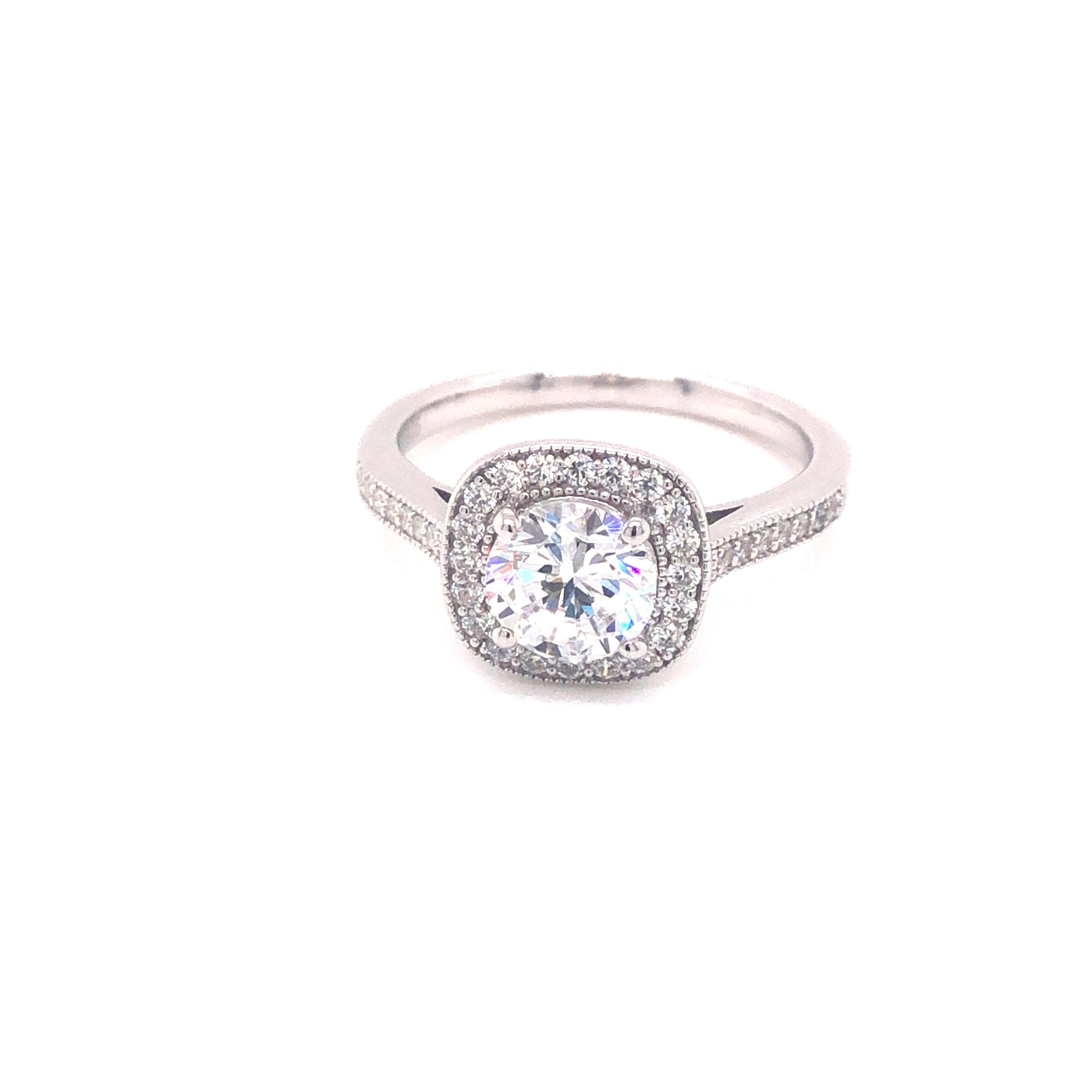 Embrace classic elegance with this vintage inspired ring. 

Featuring a 1.50ct round brilliant cutcubic zirconia, surrounded by 0.34 carat of cubic zirconia, set in 925 sterling silver with a highly polished platinum finish.

Whether you're looking