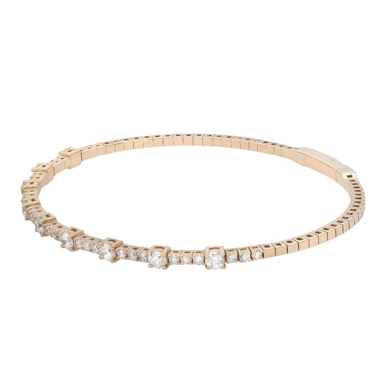 Introducing our captivating 1.50 Carat Flexible Diamond Bangle in 14K Yellow Gold. This exquisite bangle is designed to mesmerize from every angle, showcasing a pave setting of diamonds that radiate brilliance. Delicate, elegant, and wonderfully