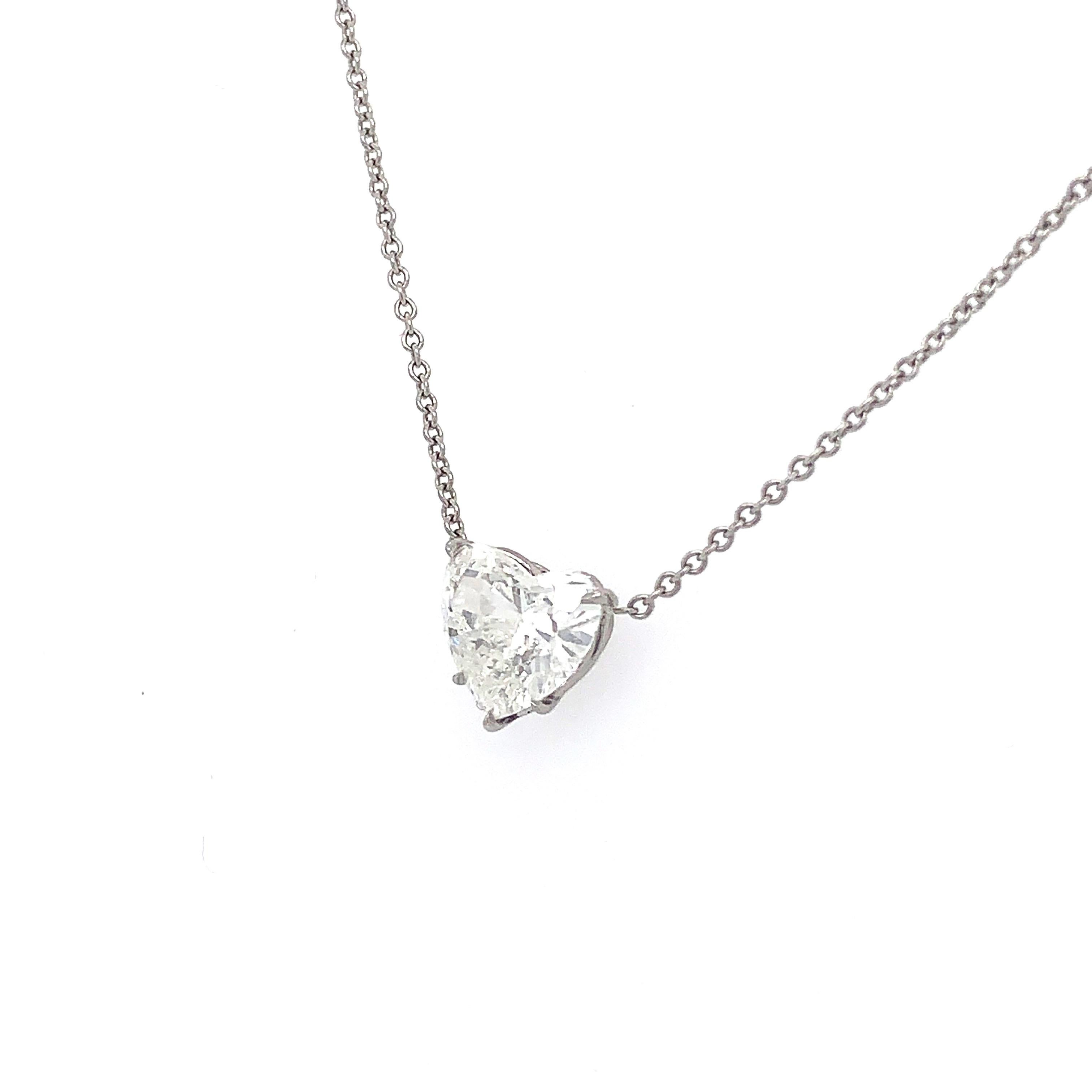 This Big looking pendant from ISSAC NUSSBAUM NEW YORK features a heart shape diamond set in hand made platinum. 
The spectacular diamond is an H color with a very fine white SI1.
Mounted on a delicate platinum chain.
This heart shape pendant