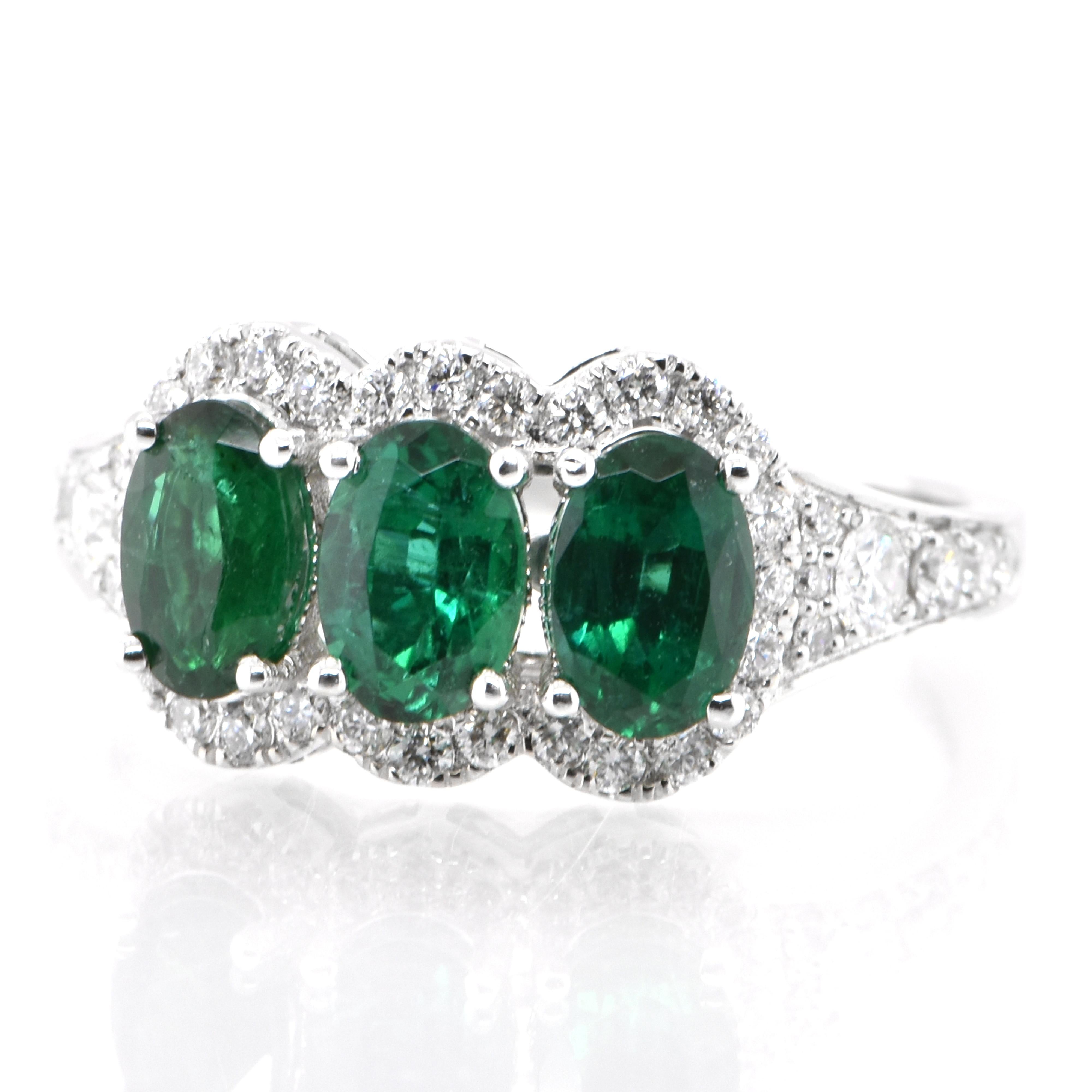 A stunning ring featuring 1.50 Carats Natural Emeralds and 0.43 Carats of Diamond Accents set in 18 Karat White Gold. People have admired emerald’s green for thousands of years. Emeralds have always been associated with the lushest landscapes and