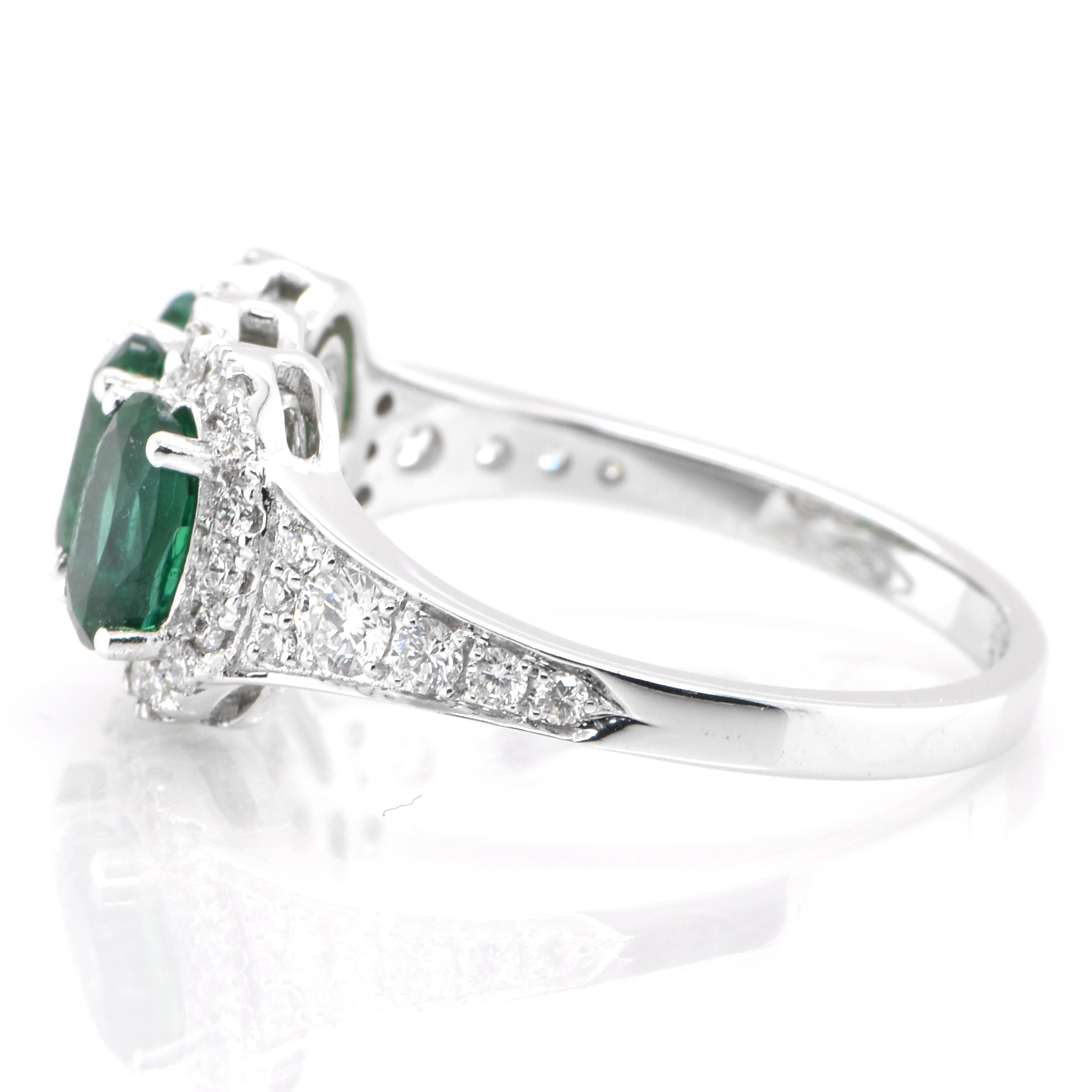Oval Cut 1.50 Carat Natural Emerald and Diamond Cluster Ring Set in 18K White Gold For Sale