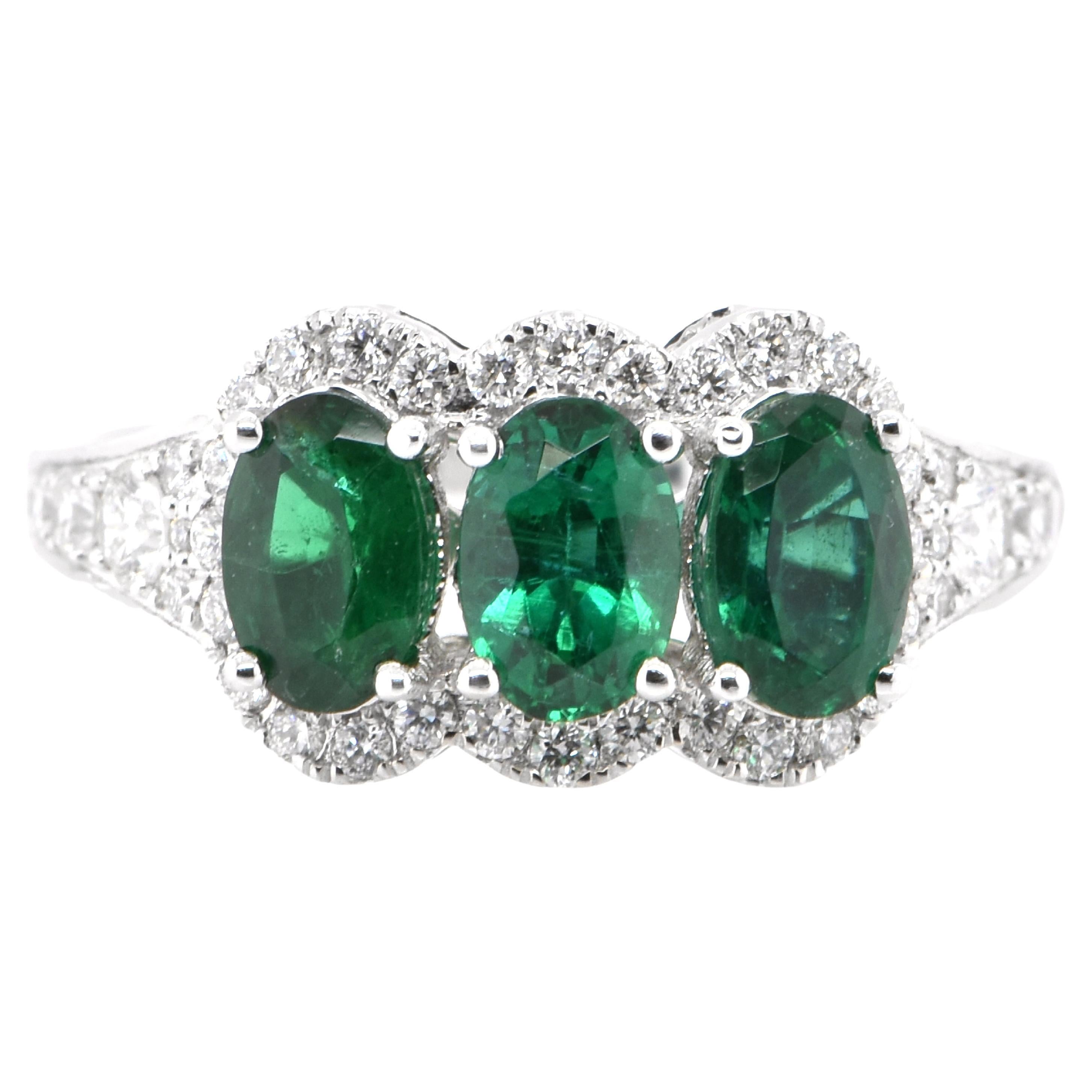 1.50 Carat Natural Emerald and Diamond Cluster Ring Set in 18K White Gold For Sale