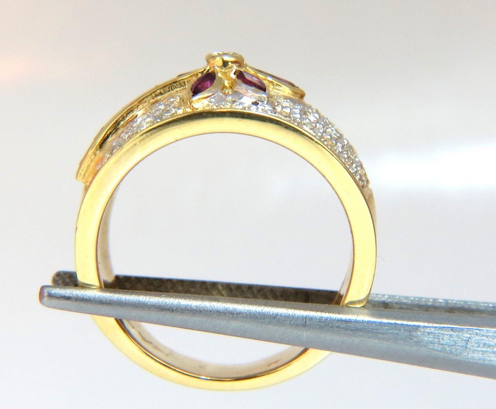  .50ct. Natural Ruby Cocktail ring 
Marquise & baguette cut, 
Fully faceted Clean clarity 
1.00ct. Diamonds:  Rounds, full cuts 
 G-color, Vs-2 clarity. 
 14kt. yellow gold. 
 10 grams. 
Deck of ring: 13mm wide
 Depth: 5mm 
 Current ring size: 7 
