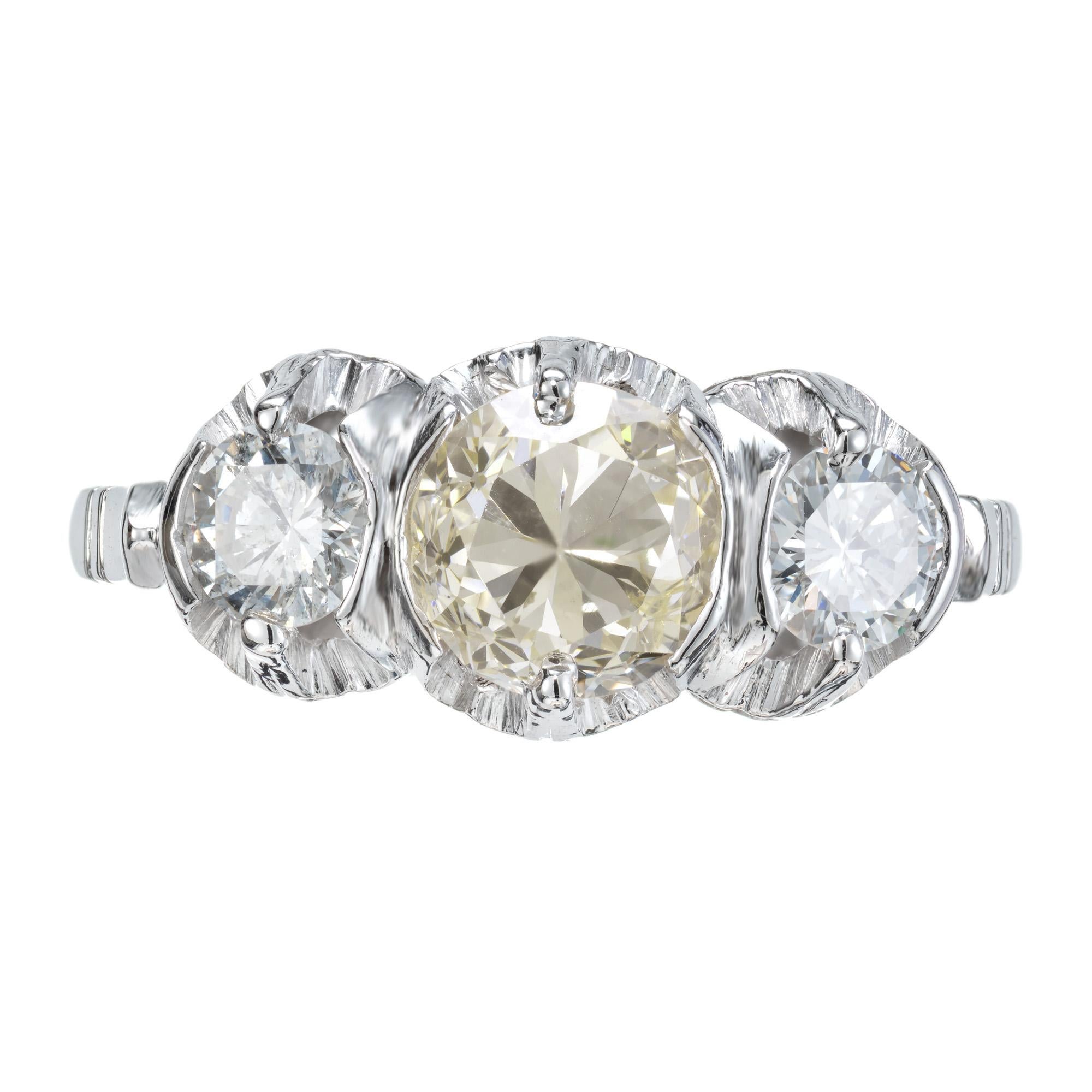 1930's Art Deco three-stone diamond ring. 1.00ct Old European cut diamond center stone. Mounted in a platinum three-stone setting. Accented with 2 round side diamonds.  Each stone is secured with tow semi bezels and two prongs. The center diamond is
