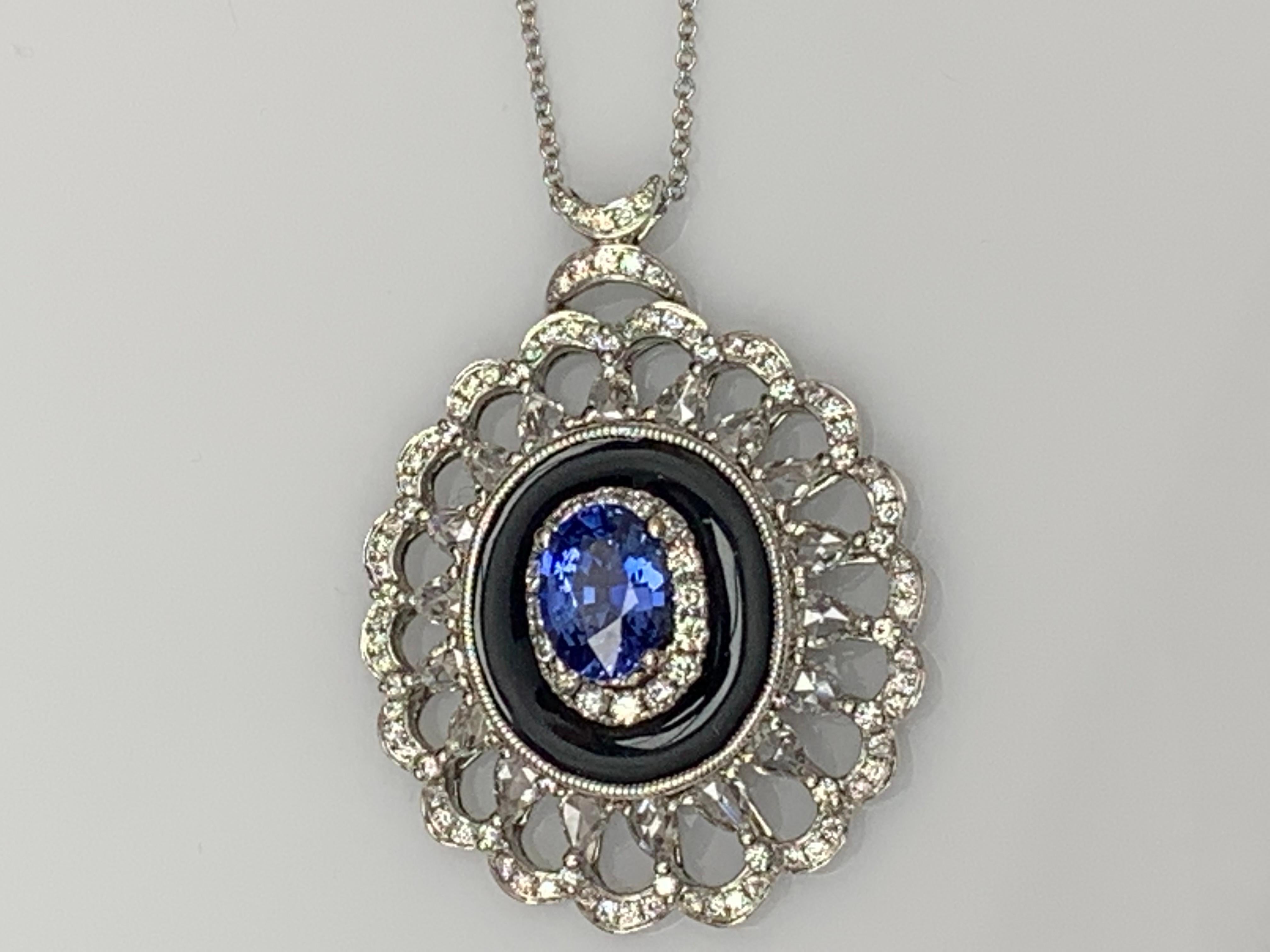A simple floral motif pendant necklace showcasing a vibrant 1.50-carat oval cut sapphire, surrounded by black enamel and 0.94 carats of 18 accent round diamonds in an open work design. Made in 18 karats white gold.

Style is available in different