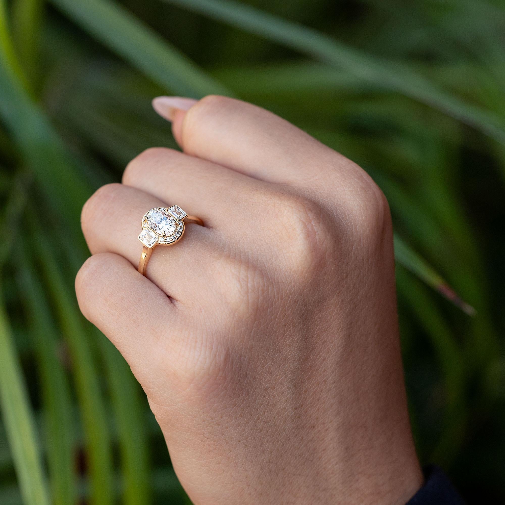 Modern 1.50 Carat Oval Diamond Yellow Gold Halo Engagement Ring For Sale