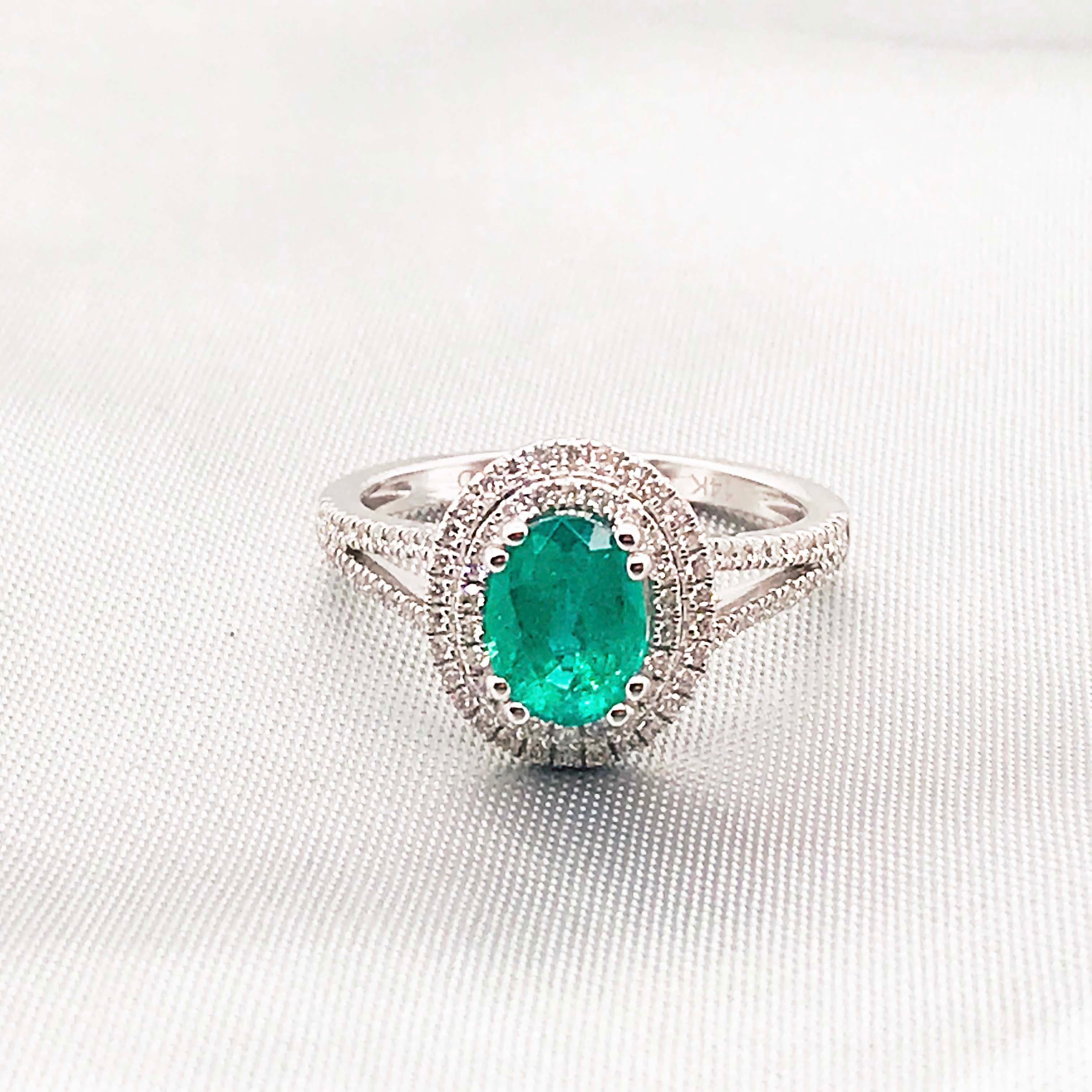1.50 Carat Oval Emerald and Diamond Halo Engagement Ring White Gold Diamond Band In New Condition For Sale In Austin, TX