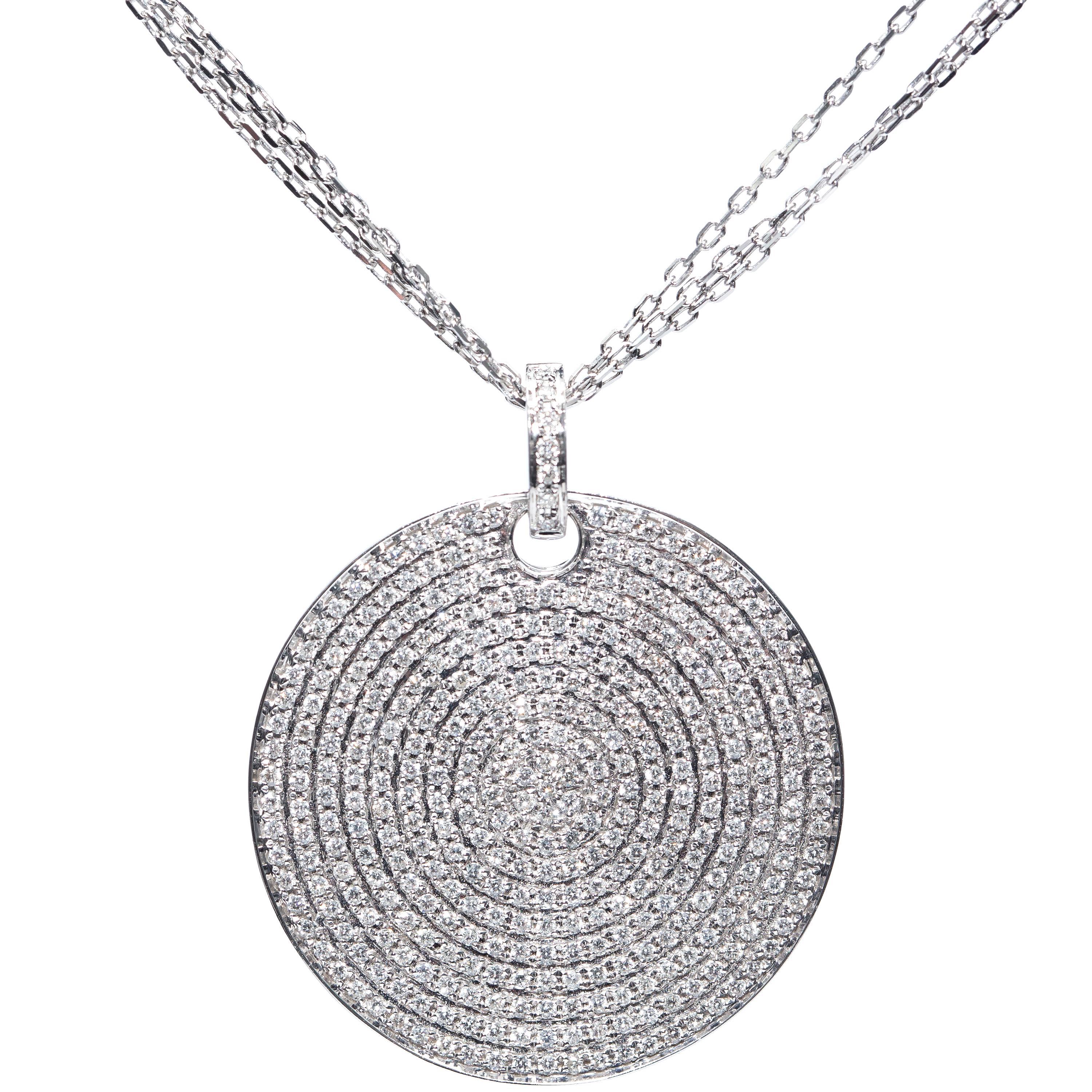 This Stunning 1.50 Carat Disc Pendant is completely adorned in a beautiful Round Brilliant Cut Diamonds. Crafted with care this show stopping Diamond Pendant is connected to a three piece chain for a contemporary feel of the highest quality. It is