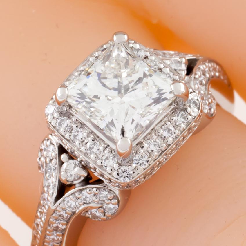 Gorgeous Platinum Engagement Ring!
Features Princess Cut Solitaire in Bucket Setting w/ Round Accent Stones in Bezel, Bucket, and Band
Center Stone
Weight = 1.50 ct
Color = G
Clarity = VS
Accent Stones
Total Weight = 1.25 ct
Average Color = I -