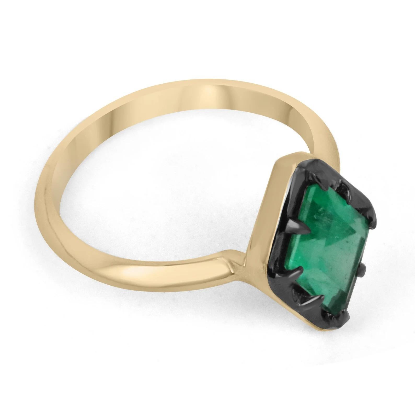 Displayed is a one-of-a-kind natural emerald, lozenge-cut solitaire gold ring. This fancy shape is extremely unique, as having emeralds cut in these rare shapes is very uncommon. This natural emerald showcases a vivacious electric medium green color