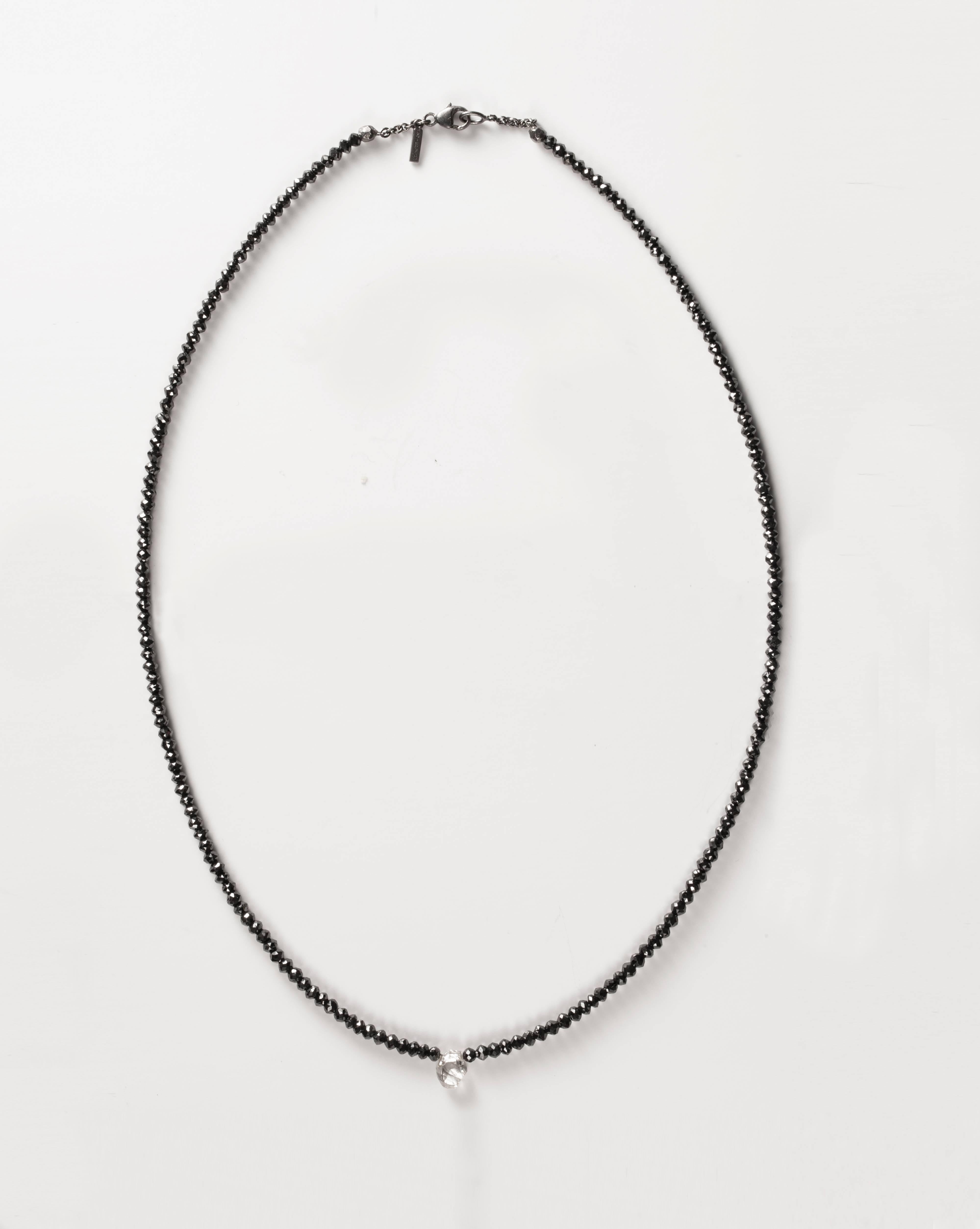 1.50 ct. Natural Whitish Rough diamond & 32.24 ct. Black Facetted diamonds in handcrafted collier.

Every rough diamond from Roughdiamonds dk has been personally handpicked by Maya Bjørnsten right before it would have been cut into “regular”