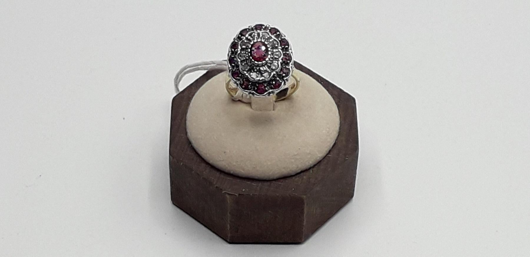 Gold and Silver ring with 1.50 Carat Rubies 0.50 Diamonds fantastic flower work. Ring size Italian 17 please see the conversion in the table in the picture. This beautiful ring of Italian luxury jewelry is perfect for a refined and elegant woman.