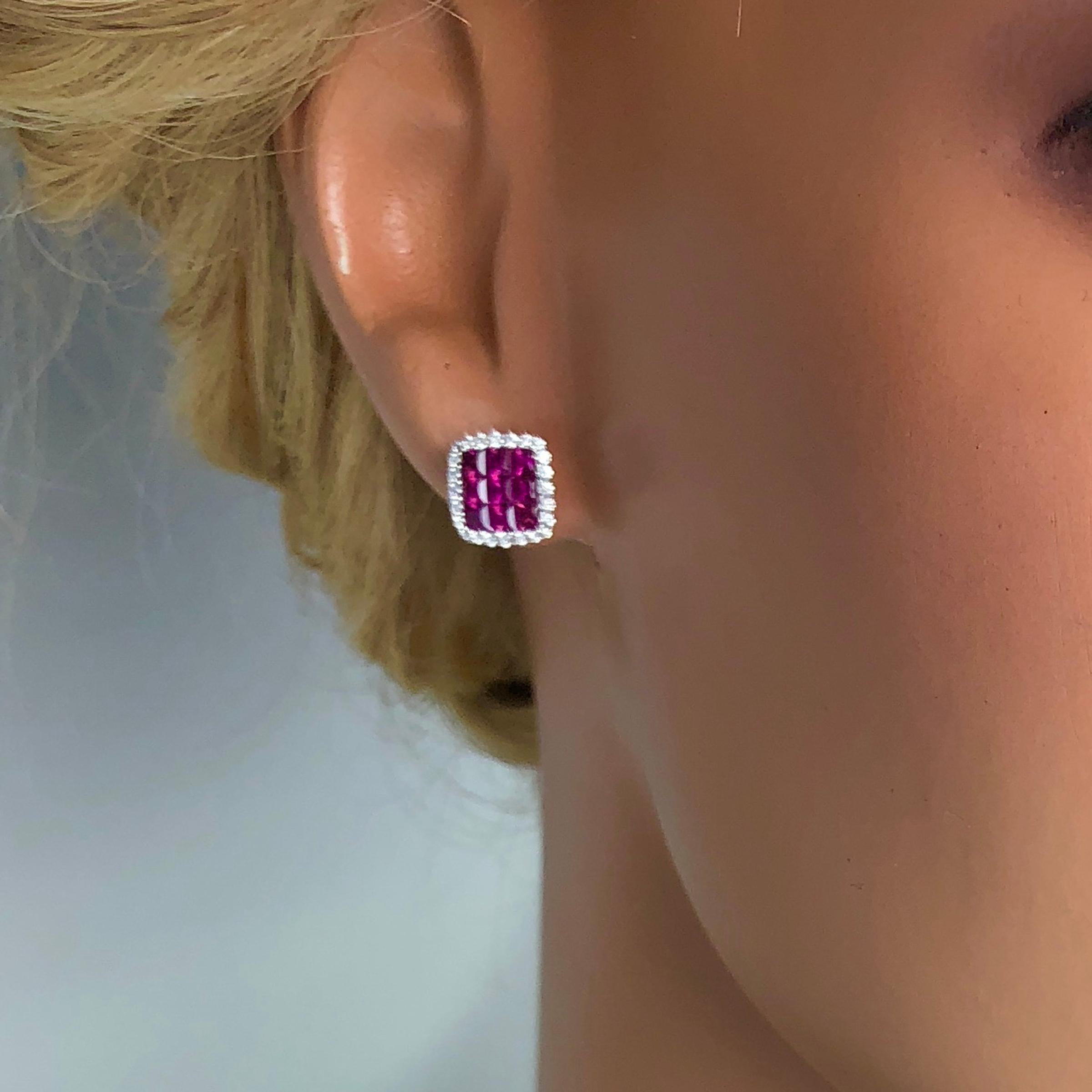 Contemporary 1.50 Carat Ruby and 0.29 Carat Diamond Halo Stud Earrings set in 18 Karat Gold