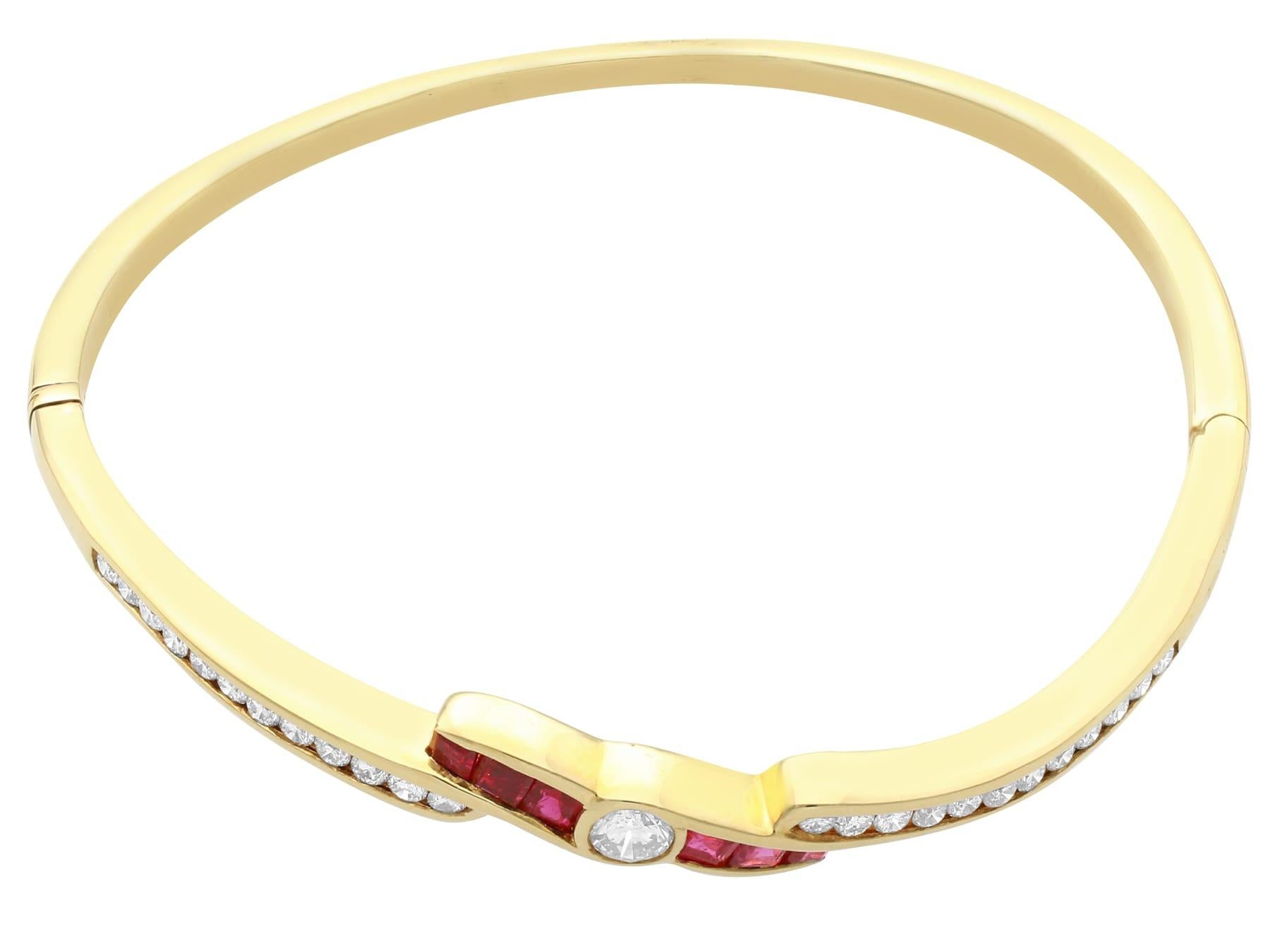Round Cut 1.50 Carat Ruby and 1.36 Carat Diamond and Yellow Gold Bangle, circa 2010 For Sale