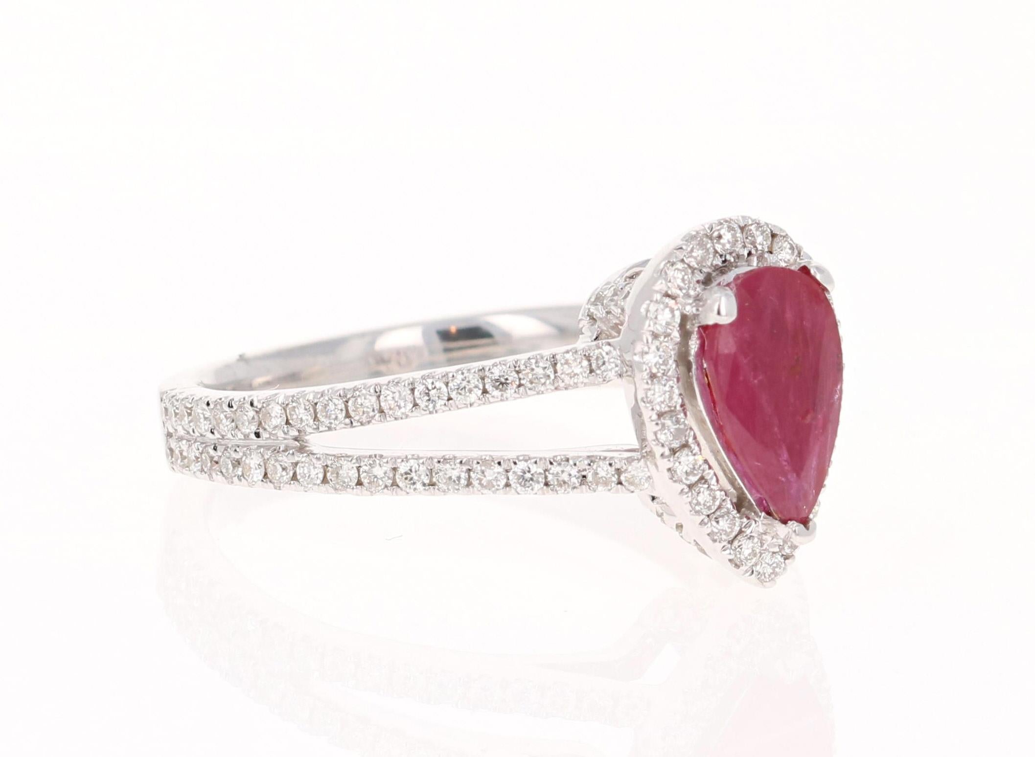 This is simply a beautiful Pear Cut Ruby and Diamond ring. The Pear Cut Ruby measures at 5 mm x 8 mm and the face of the ring measures at 8 mm x 12 mm. It weighs 0.96 Carats and is surrounded by 99 Round Cut Diamonds that weigh 0.54 Carats.